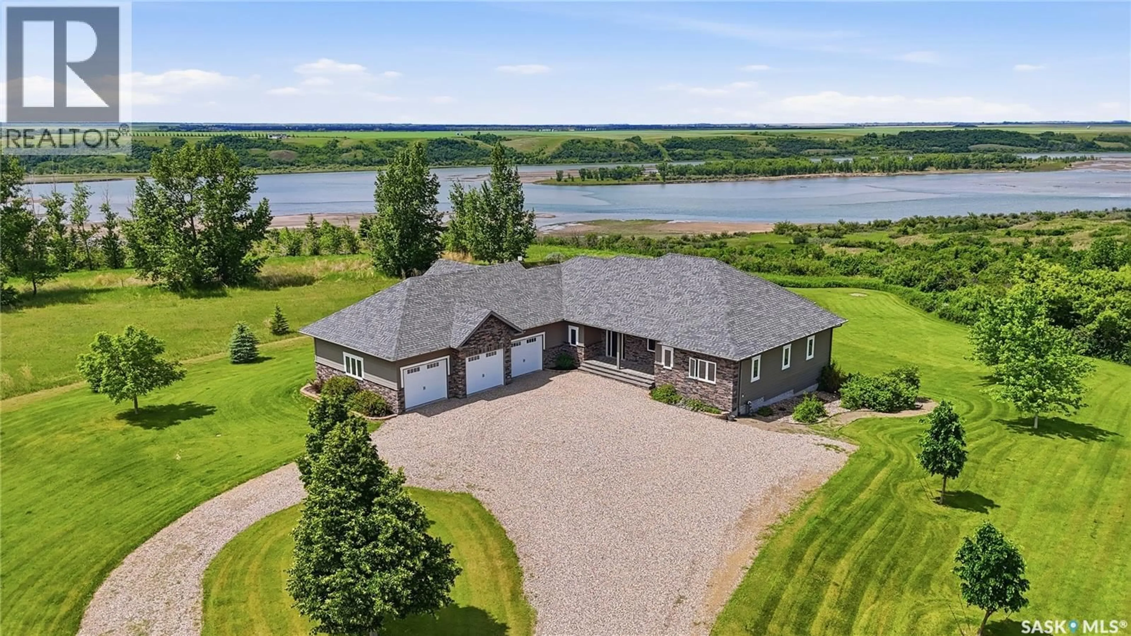 A pic from outside/outdoor area/front of a property/back of a property/a pic from drone, water/lake/river/ocean view for 102 RUDY LANE, Outlook Saskatchewan S0L2N0
