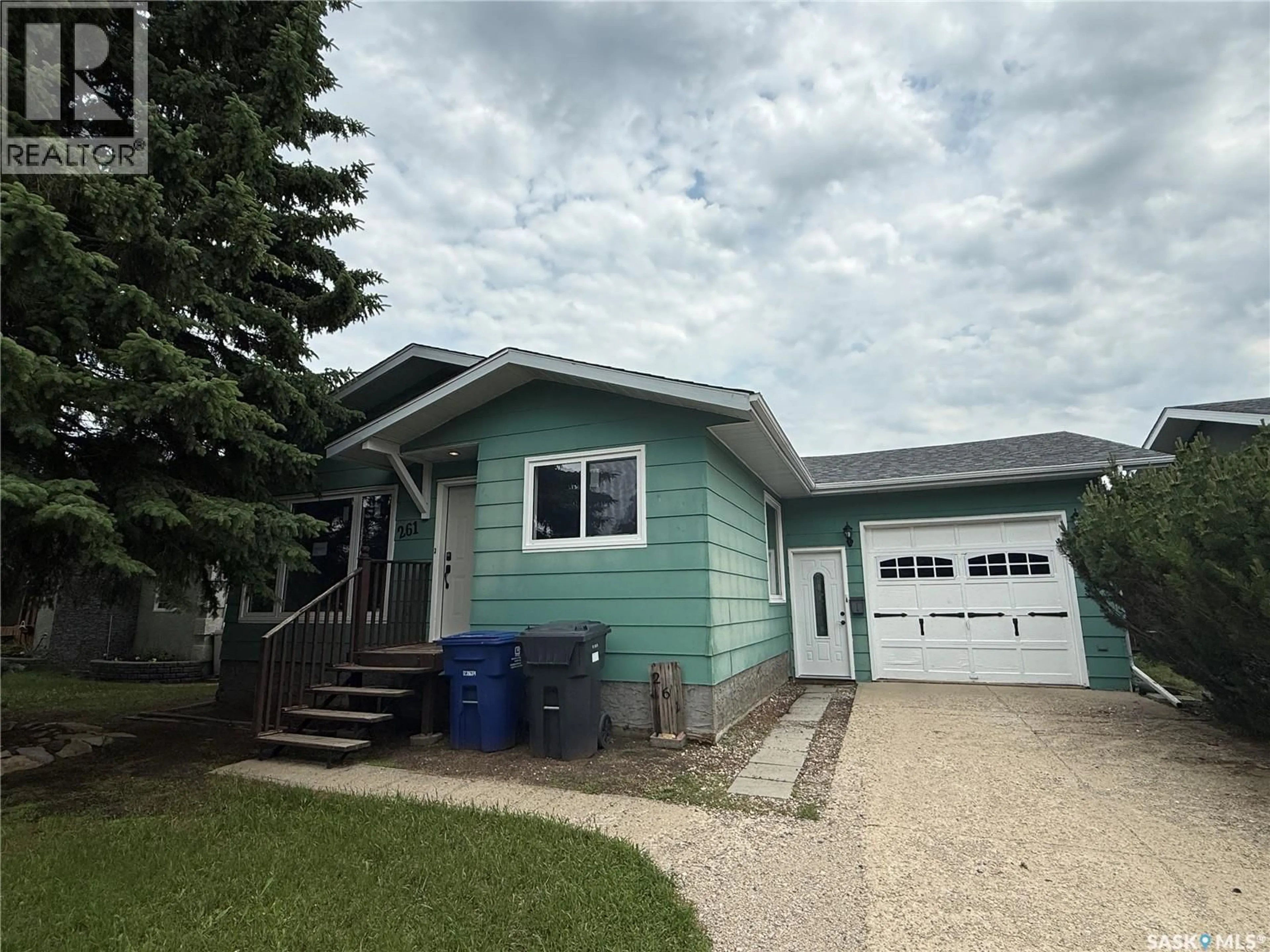 Home with vinyl exterior material, street for 261 BEAN CRESCENT, Weyburn Saskatchewan S4H3A3