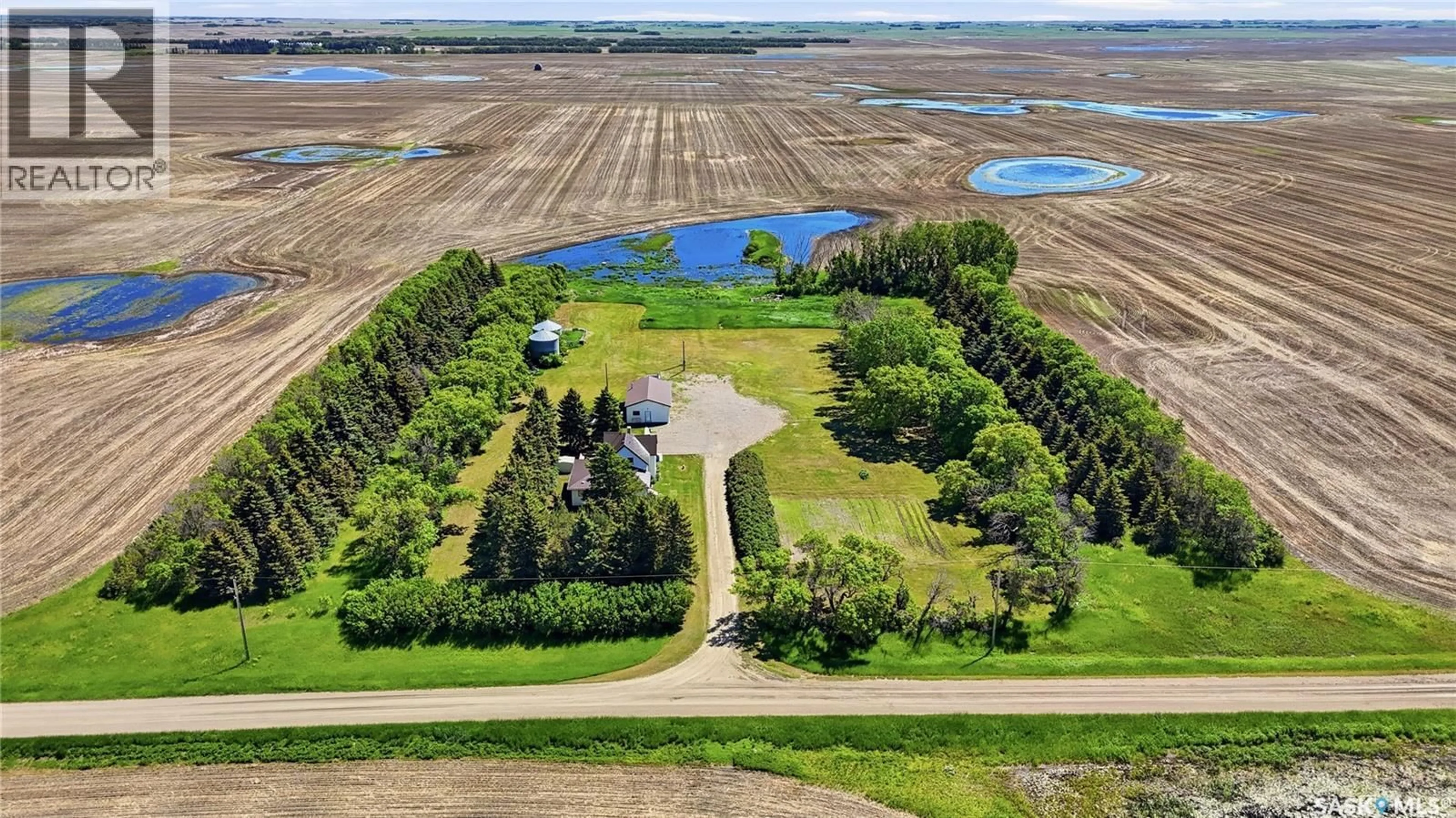 A pic from outside/outdoor area/front of a property/back of a property/a pic from drone, water/lake/river/ocean view for WATROUS WEST ACREAGE, Morris Rm No. 312 Saskatchewan S0K4Y0