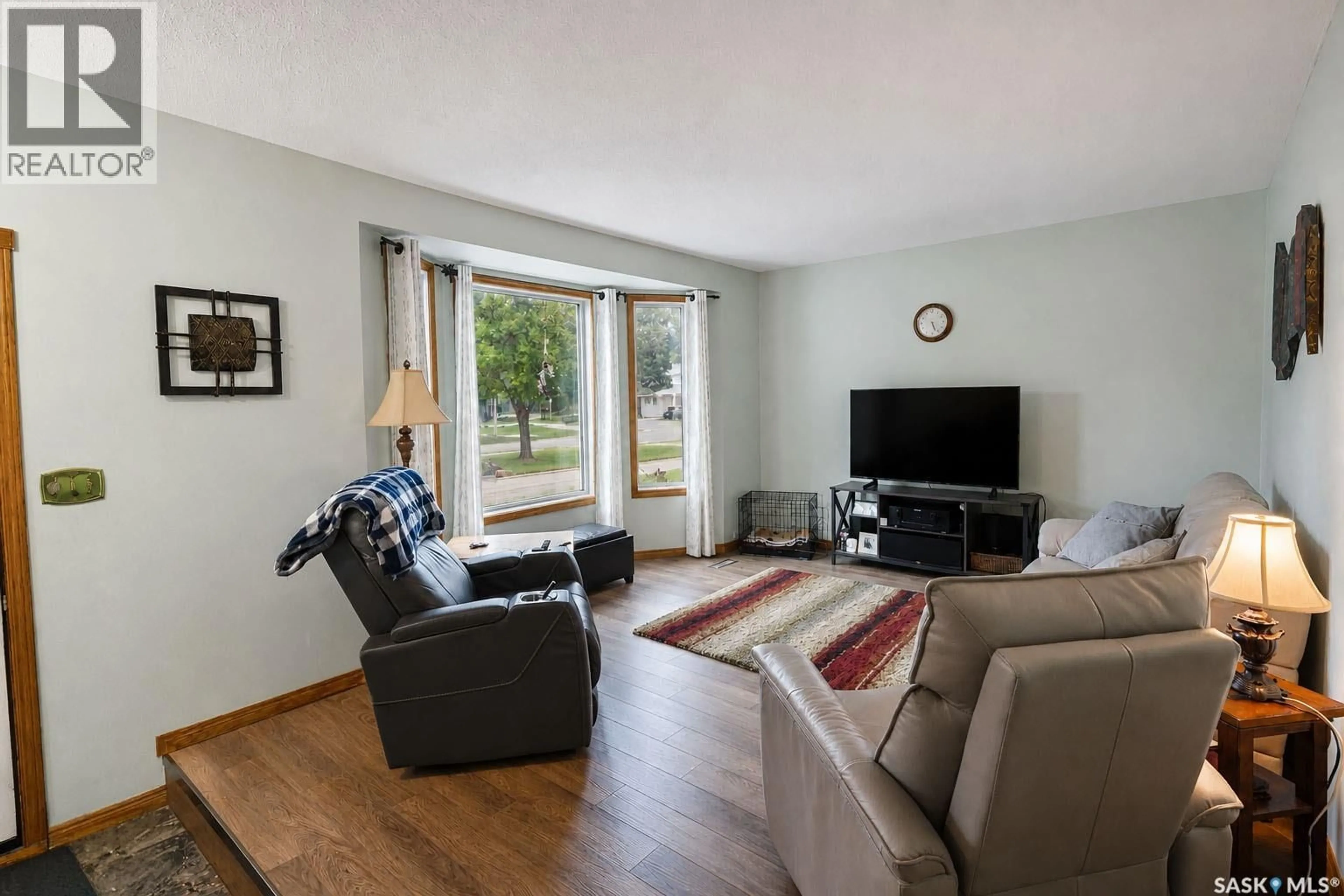 Living room with furniture, wood/laminate floor for 1611 OLIVE DIEFENBAKER DRIVE, Prince Albert Saskatchewan S6V7V9