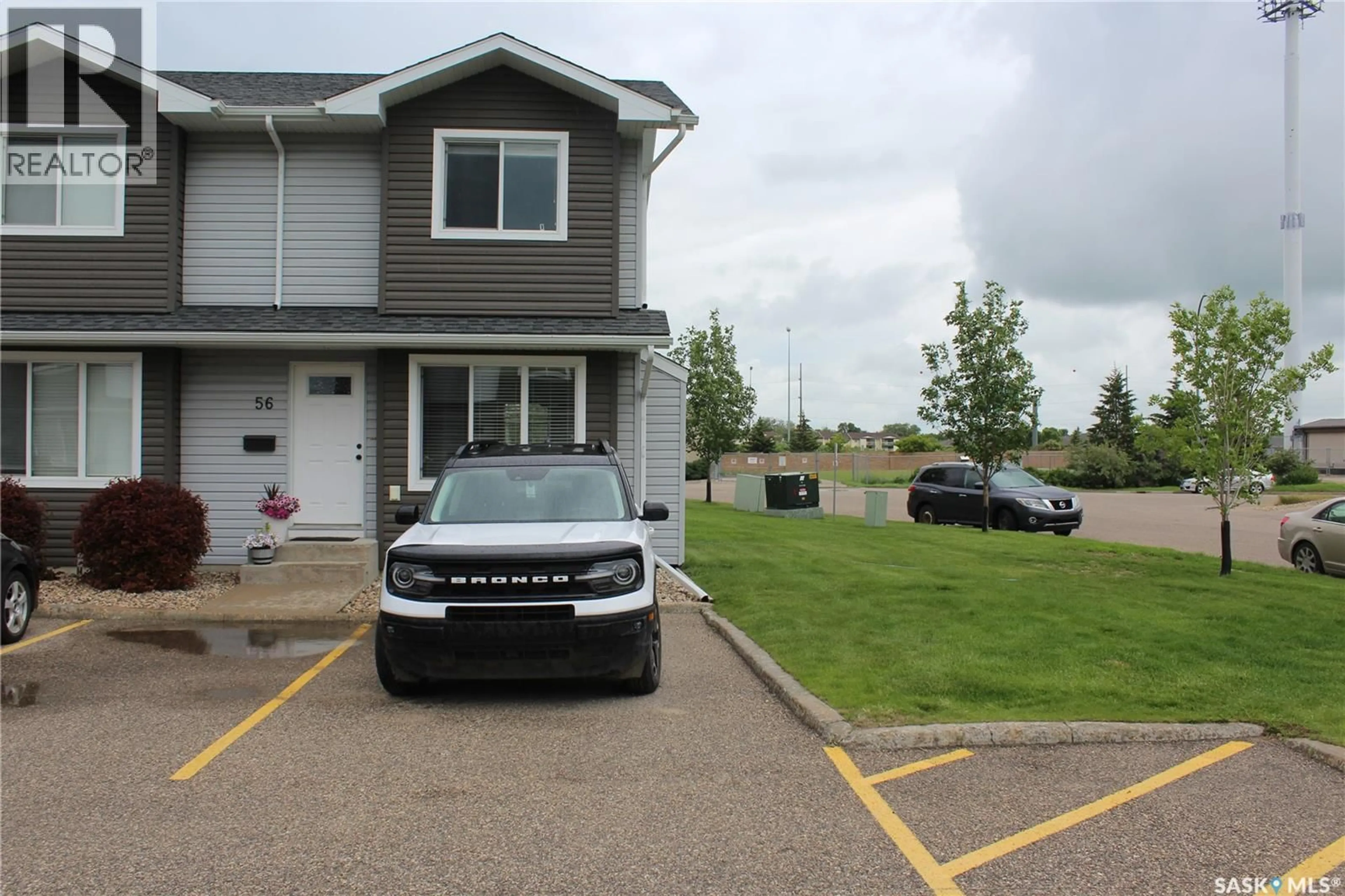 A pic from outside/outdoor area/front of a property/back of a property/a pic from drone, street for 4850 - 56 HARBOUR LANDING DRIVE, Regina Saskatchewan S4W0K9
