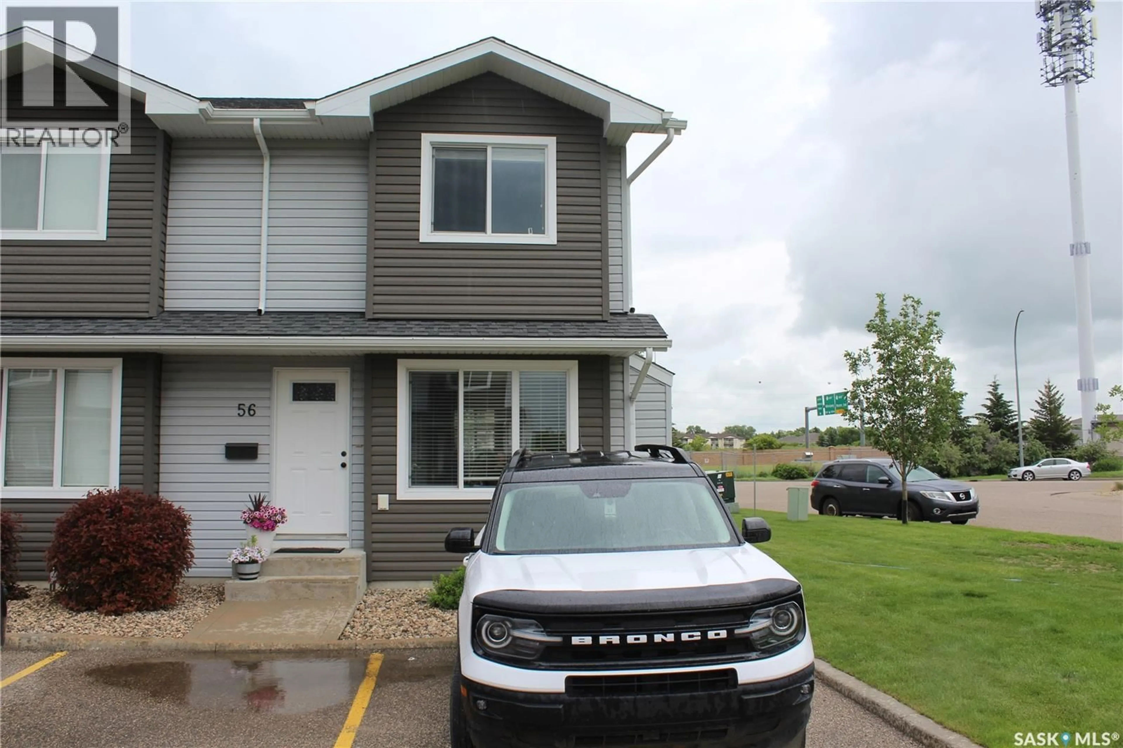 Home with vinyl exterior material, street for 4850 - 56 HARBOUR LANDING DRIVE, Regina Saskatchewan S4W0K9
