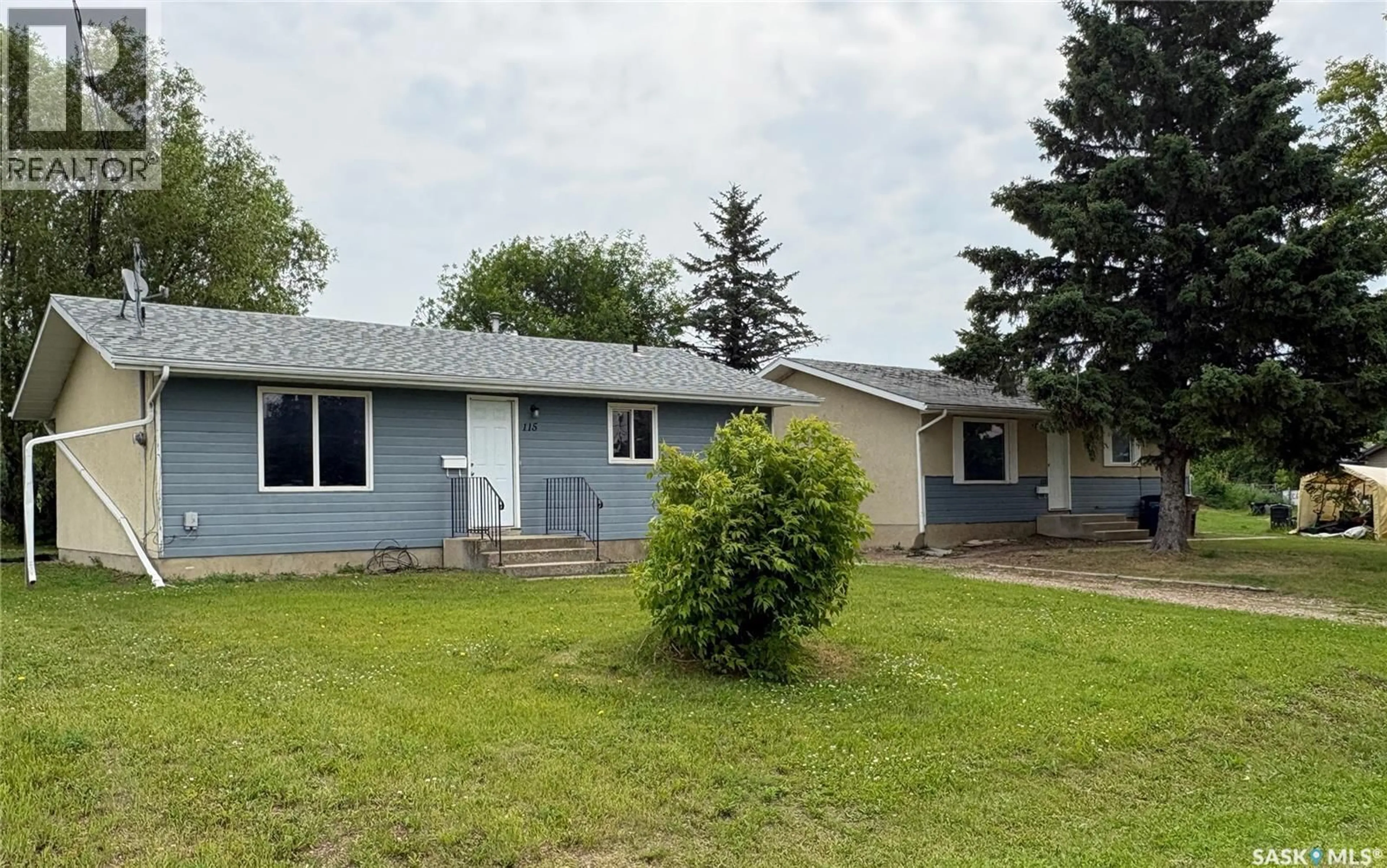 Home with vinyl exterior material, street for 111-115 MILL AVENUE, Big River Saskatchewan S0J0E0