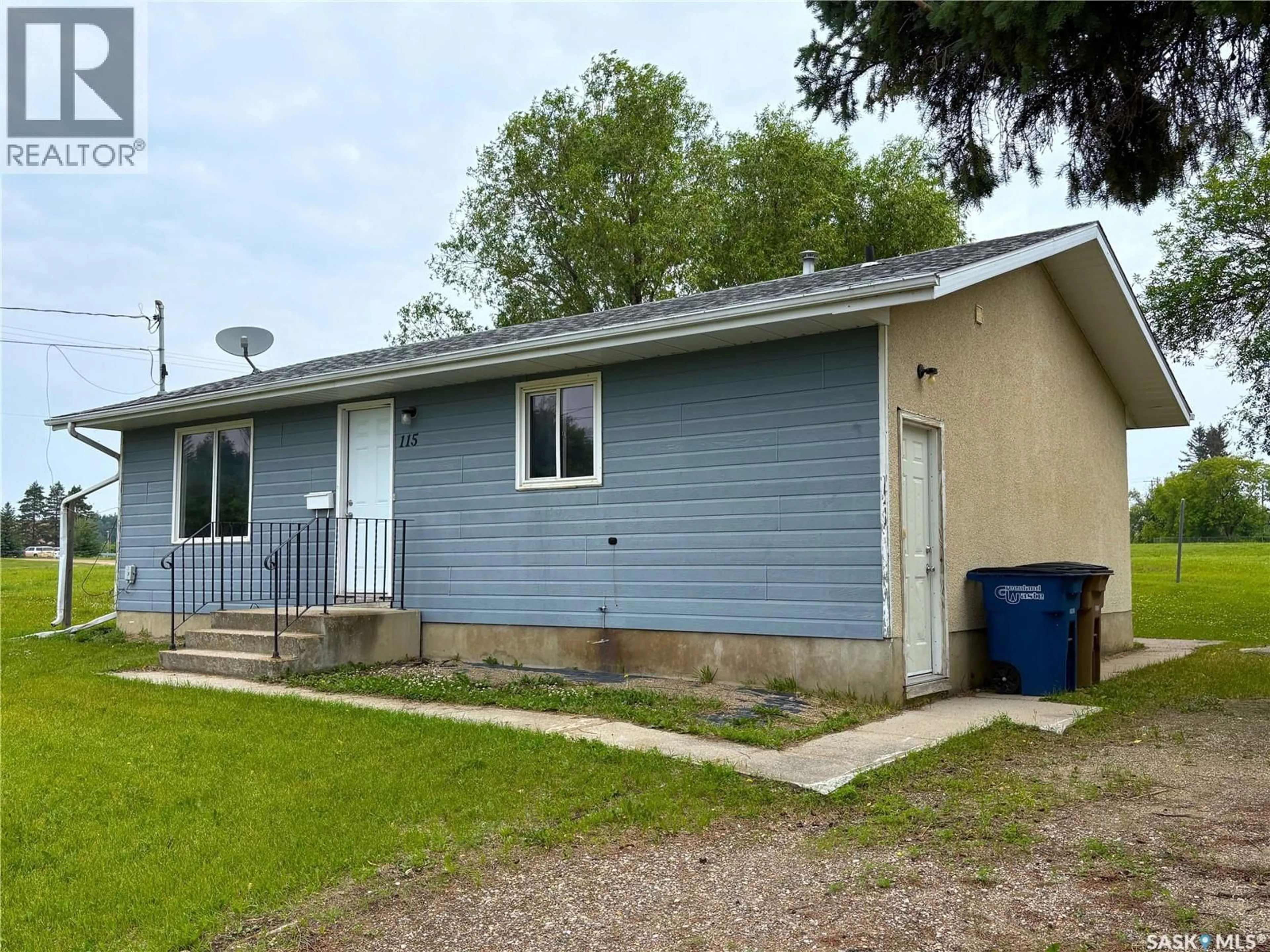 Home with vinyl exterior material, street for 111-115 MILL AVENUE, Big River Saskatchewan S0J0E0