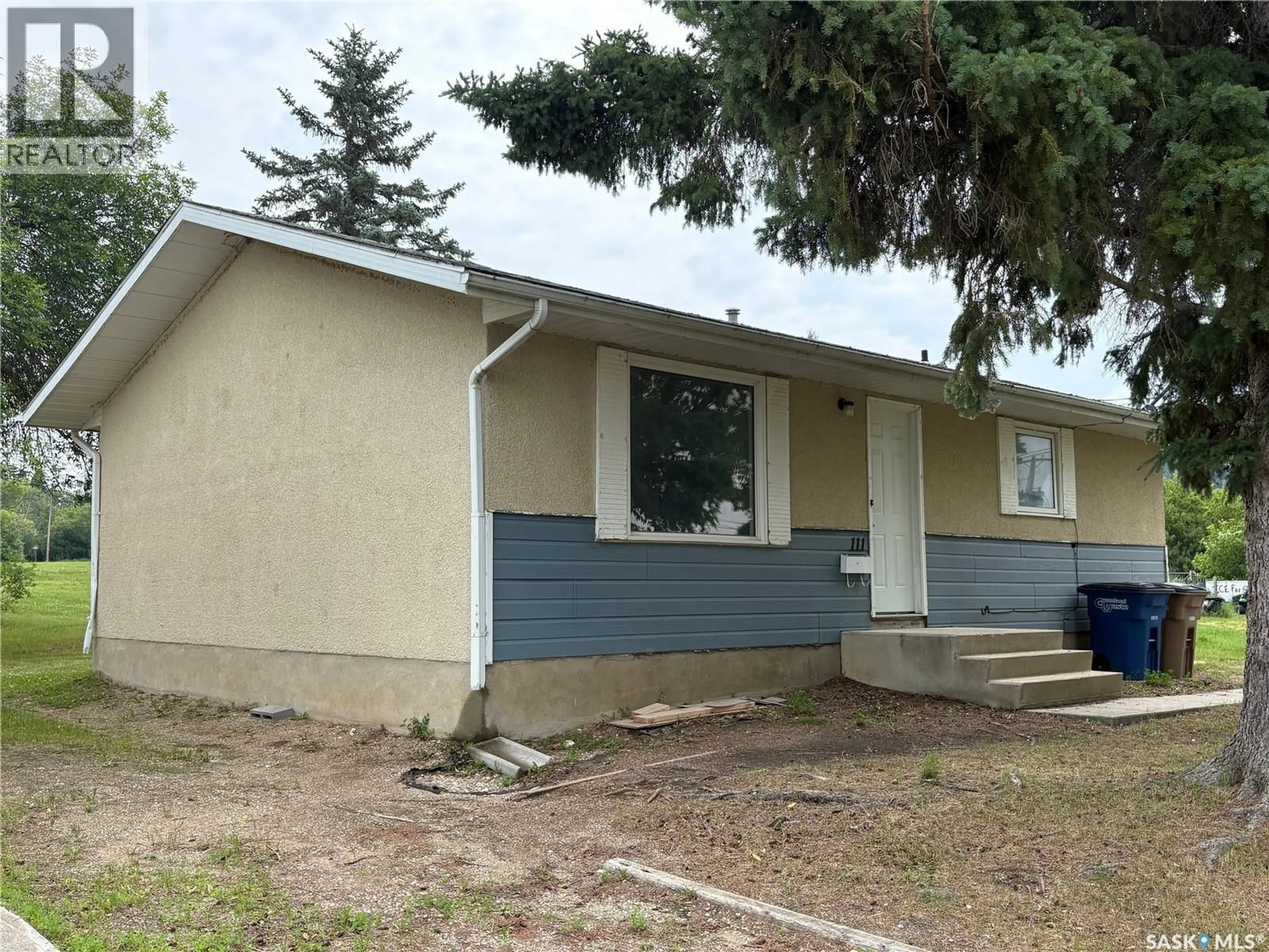 Home with vinyl exterior material, street for 111-115 MILL AVENUE, Big River Saskatchewan S0J0E0