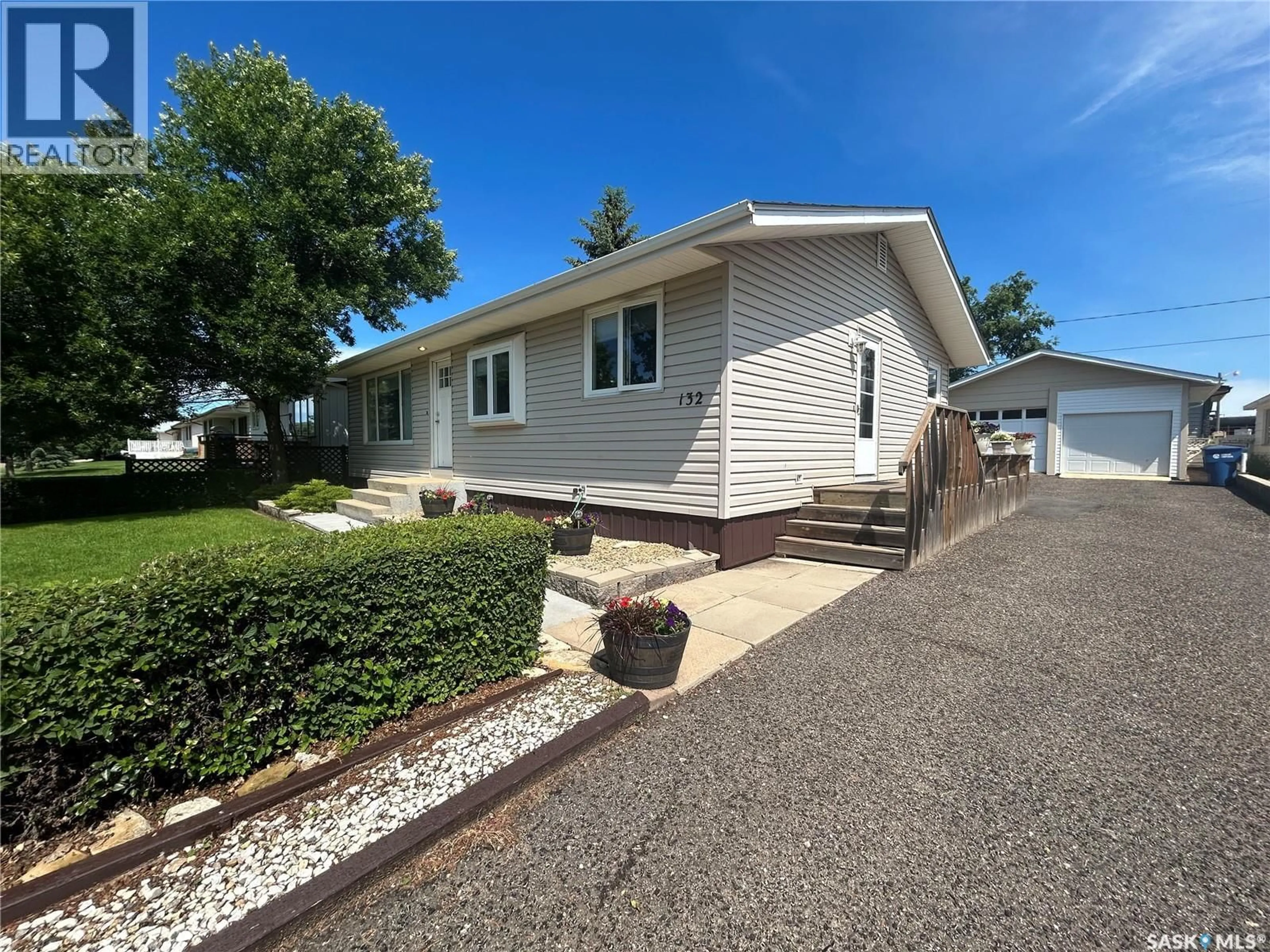 Home with vinyl exterior material, street for 132 CHURCHILL AVENUE, Coronach Saskatchewan S0H0Z0