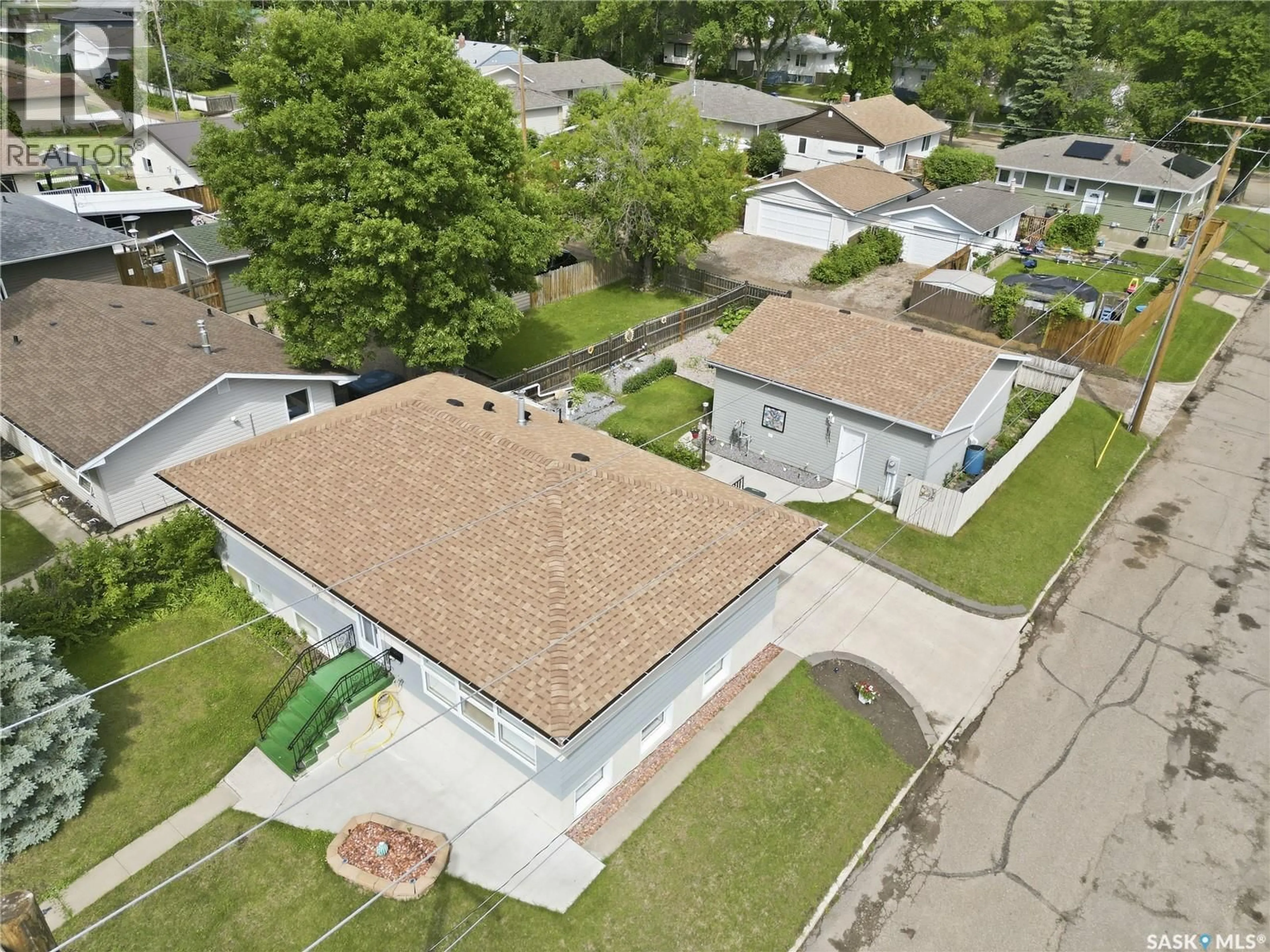 A pic from outside/outdoor area/front of a property/back of a property/a pic from drone, street for 1402 93RD STREET, North Battleford Saskatchewan S9A0C1