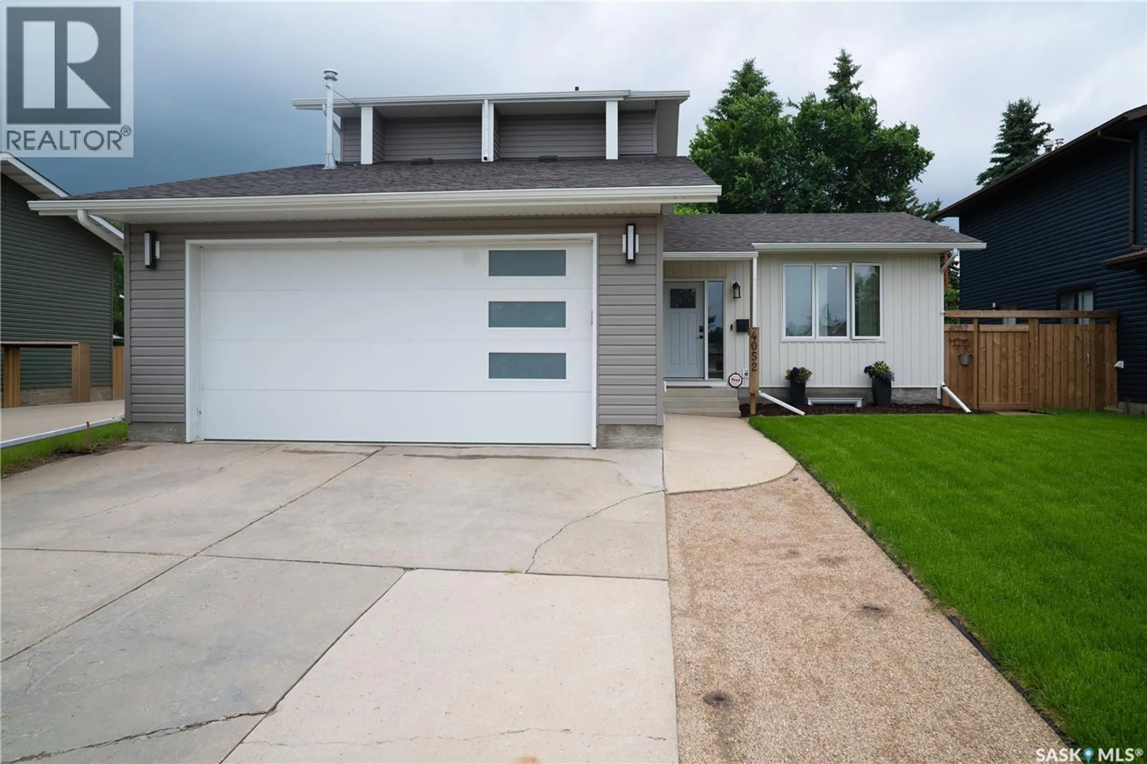 Home with vinyl exterior material, street for 4052 TAYLOR STREET, Saskatoon Saskatchewan S7H5J5