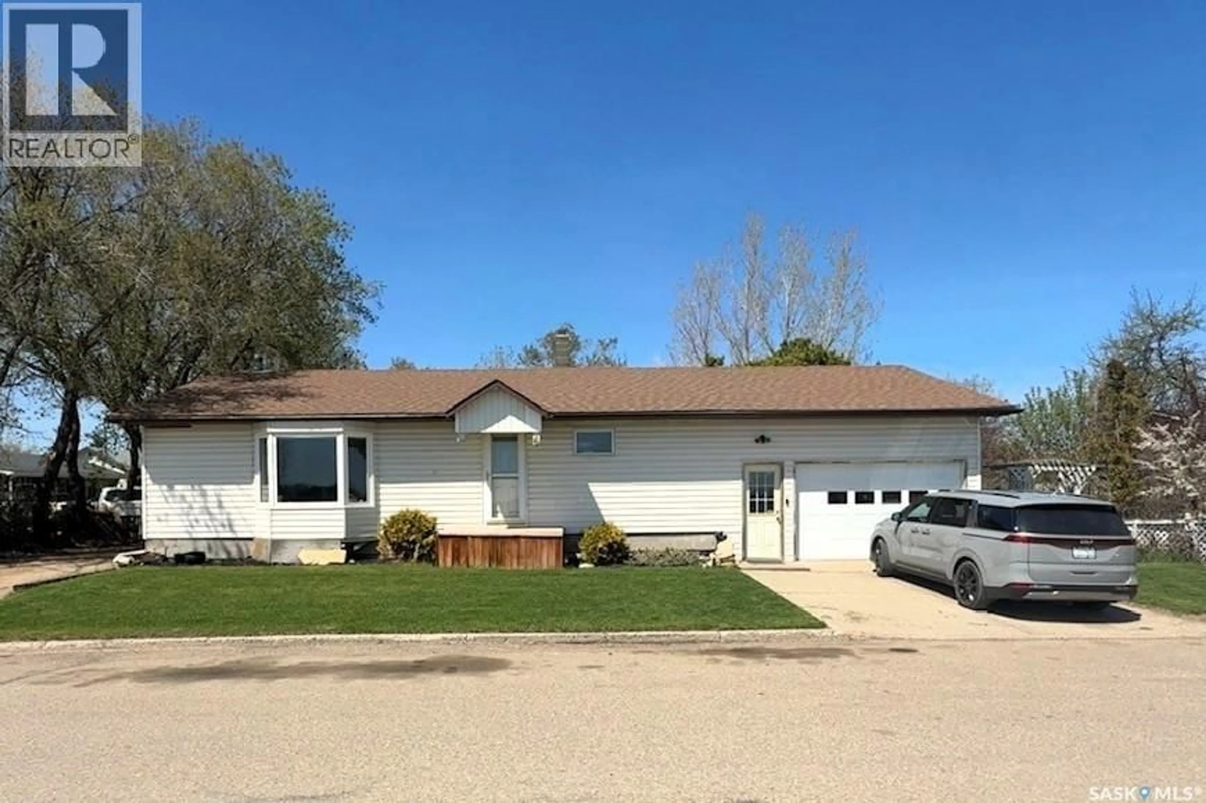 Home with vinyl exterior material, street for 60 RAILWAY AVENUE, Redvers Saskatchewan S0C2H0