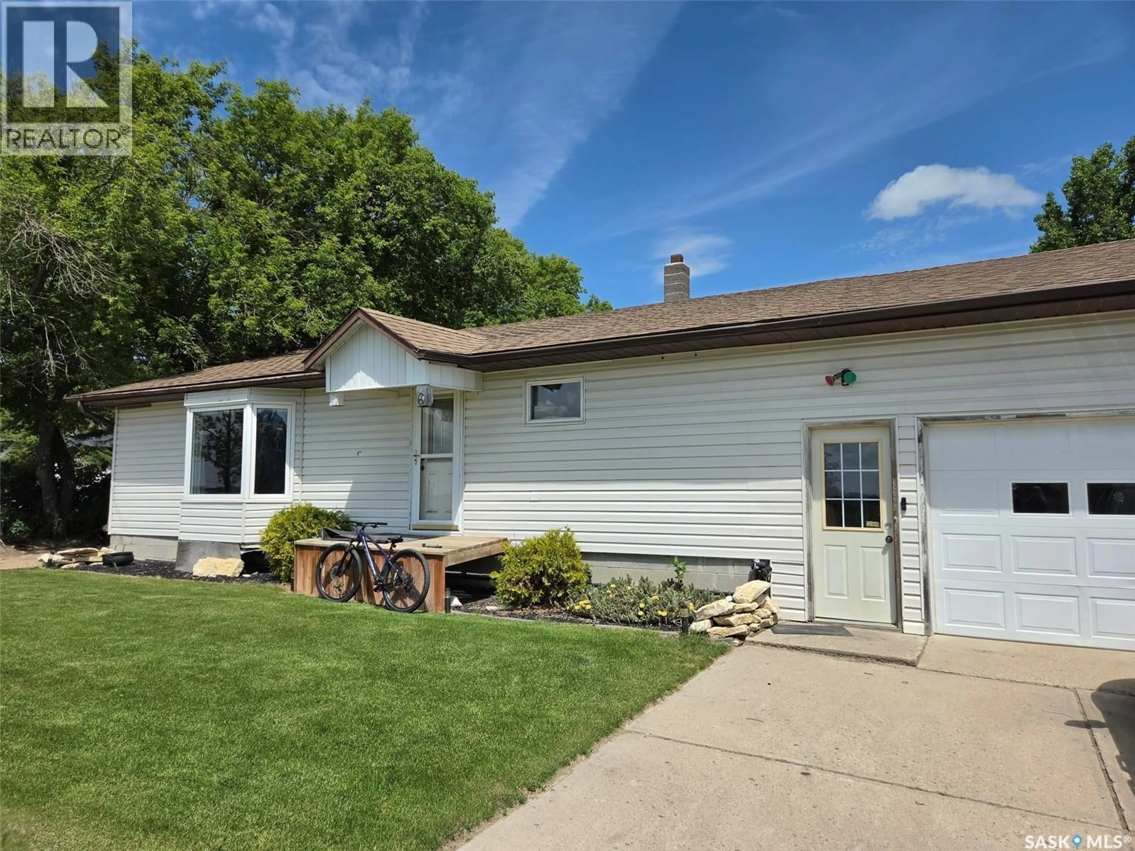 Home with vinyl exterior material, street for 60 RAILWAY AVENUE, Redvers Saskatchewan S0C2H0