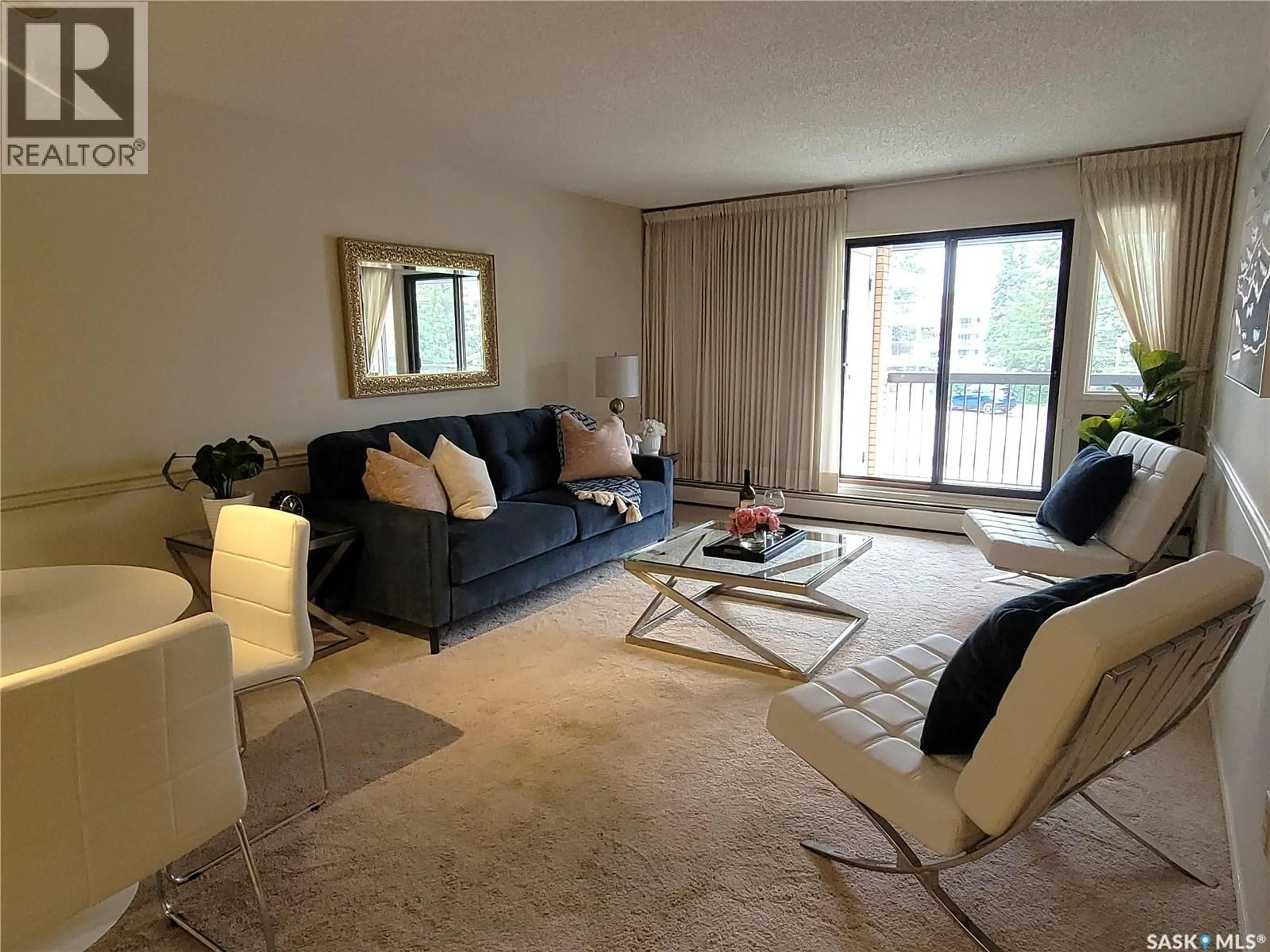 Living room with furniture, carpet floor for 217A - 204 CREE PLACE, Saskatoon Saskatchewan S7K7Z3