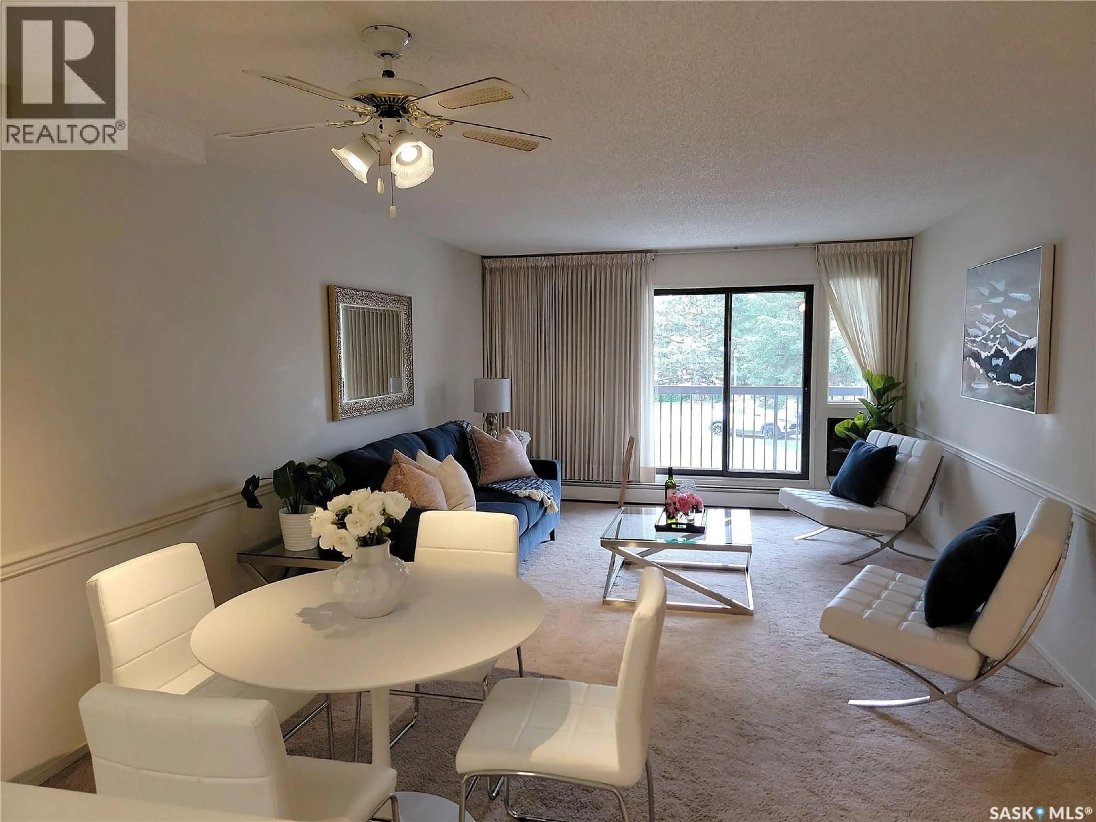 Living room with furniture, wood/laminate floor for 217A - 204 CREE PLACE, Saskatoon Saskatchewan S7K7Z3