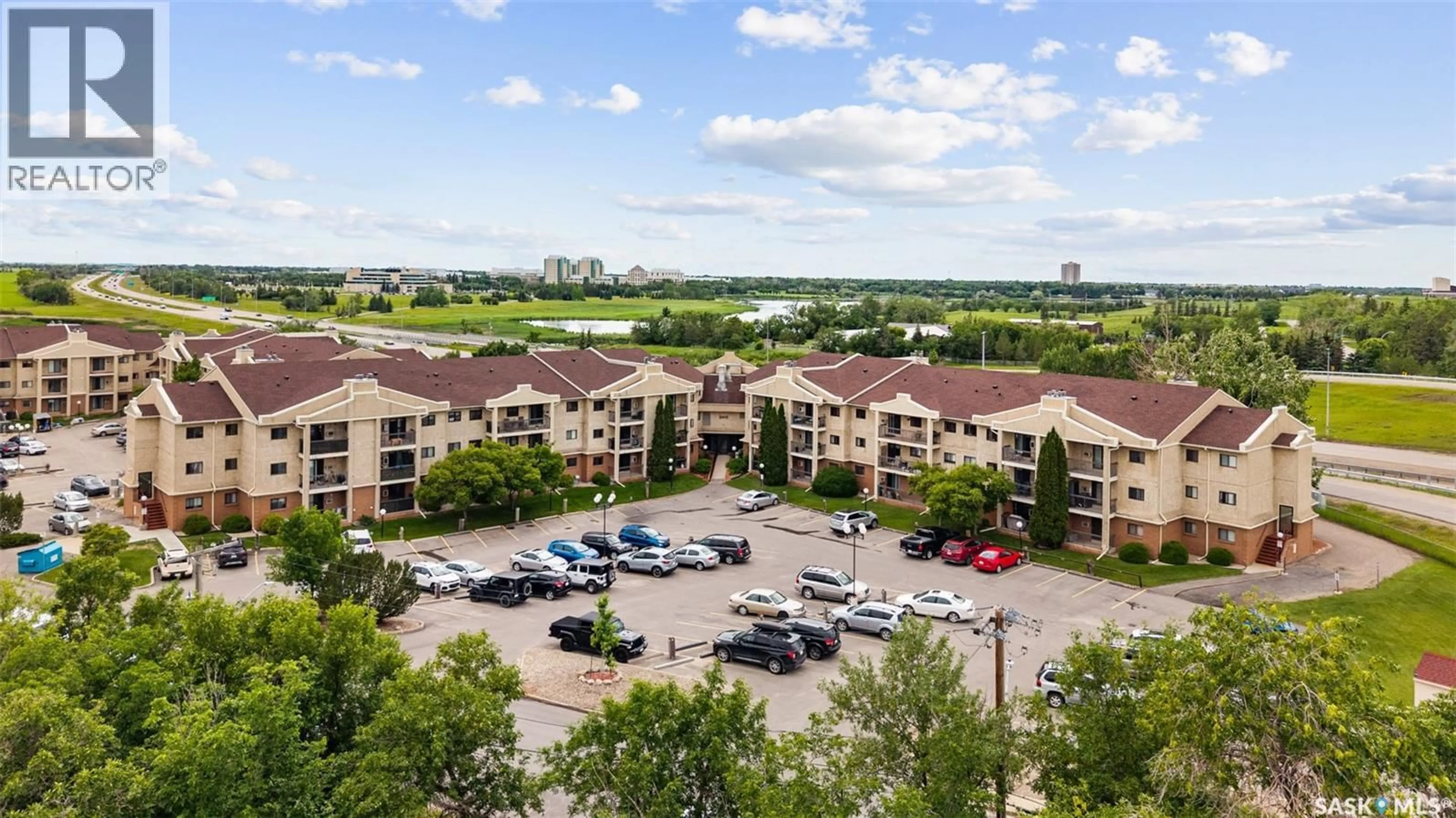 A pic from outside/outdoor area/front of a property/back of a property/a pic from drone, water/lake/river/ocean view for 114 3410 PARK STREET, Regina Saskatchewan S4V2M8