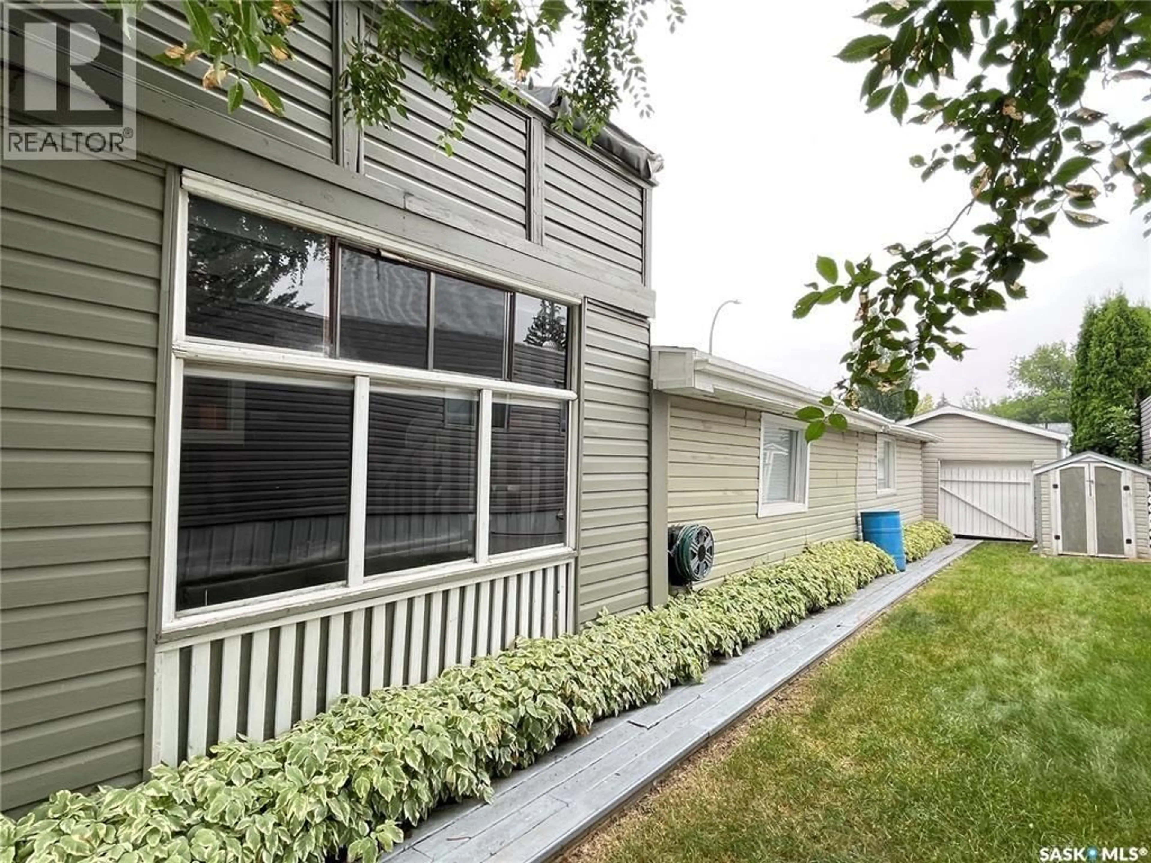 Home with vinyl exterior material, street for 1035 - 65 BOYCHUK DRIVE, Saskatoon Saskatchewan S7H5B2