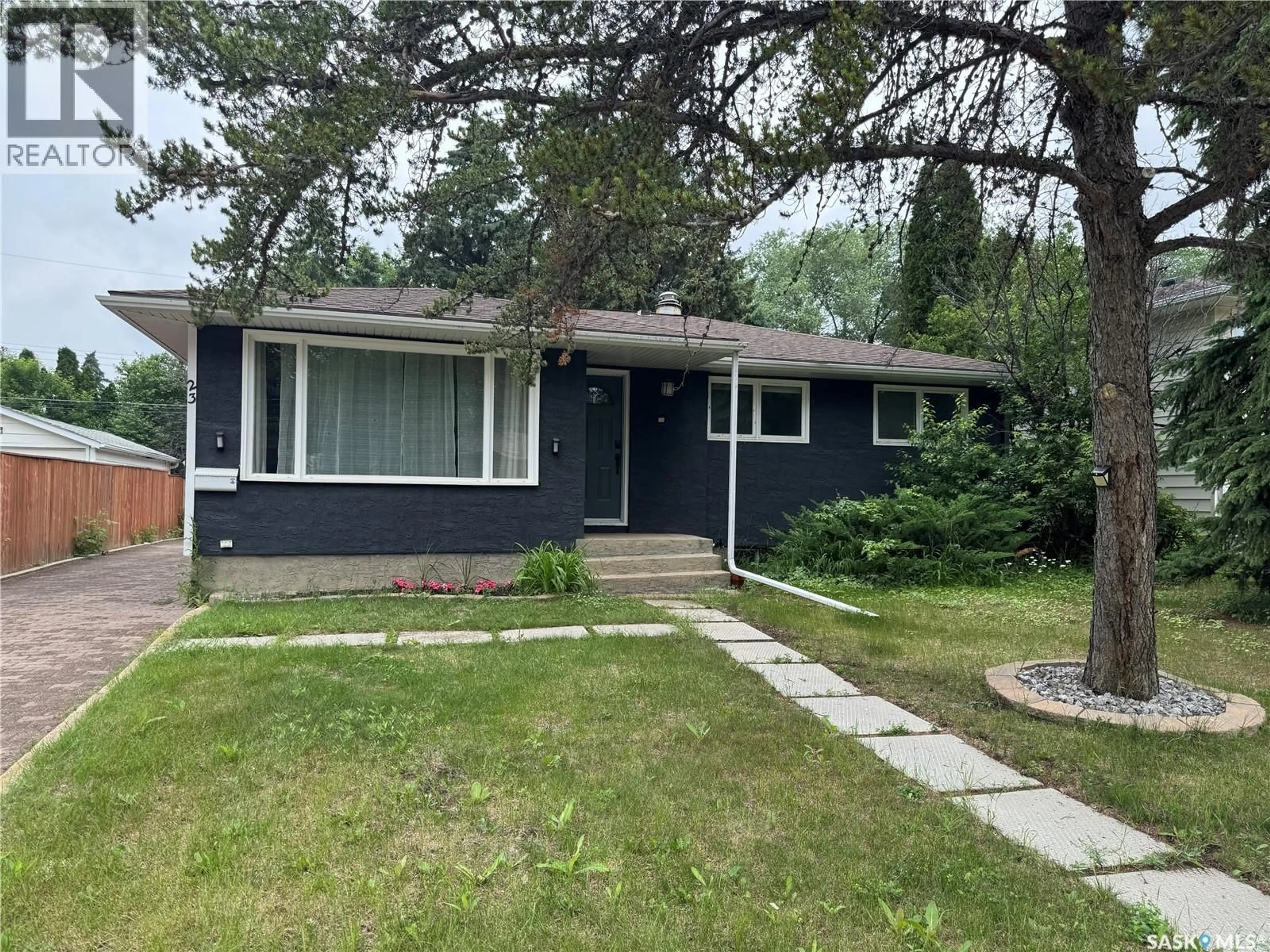 Home with vinyl exterior material, street for 23 DUNNING CRESCENT, Saskatoon Saskatchewan S7J2S6