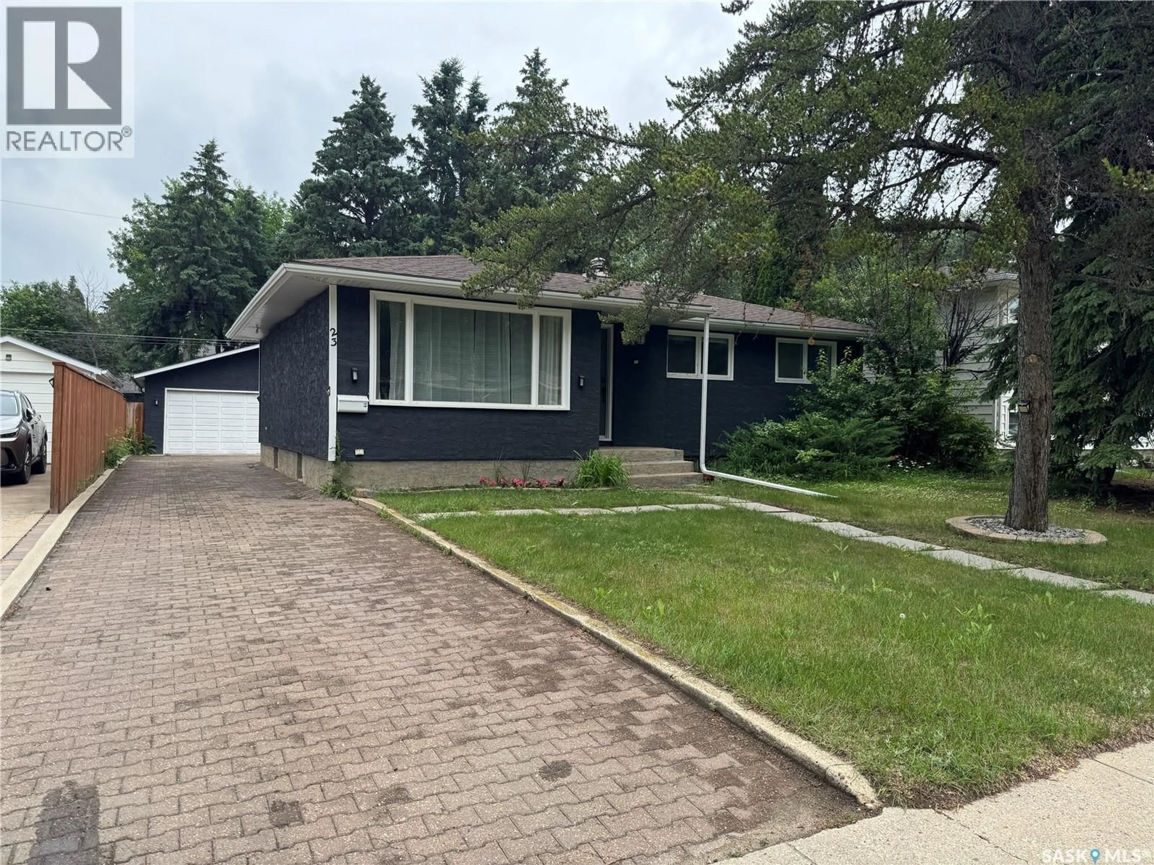 Home with vinyl exterior material, street for 23 DUNNING CRESCENT, Saskatoon Saskatchewan S7J2S6