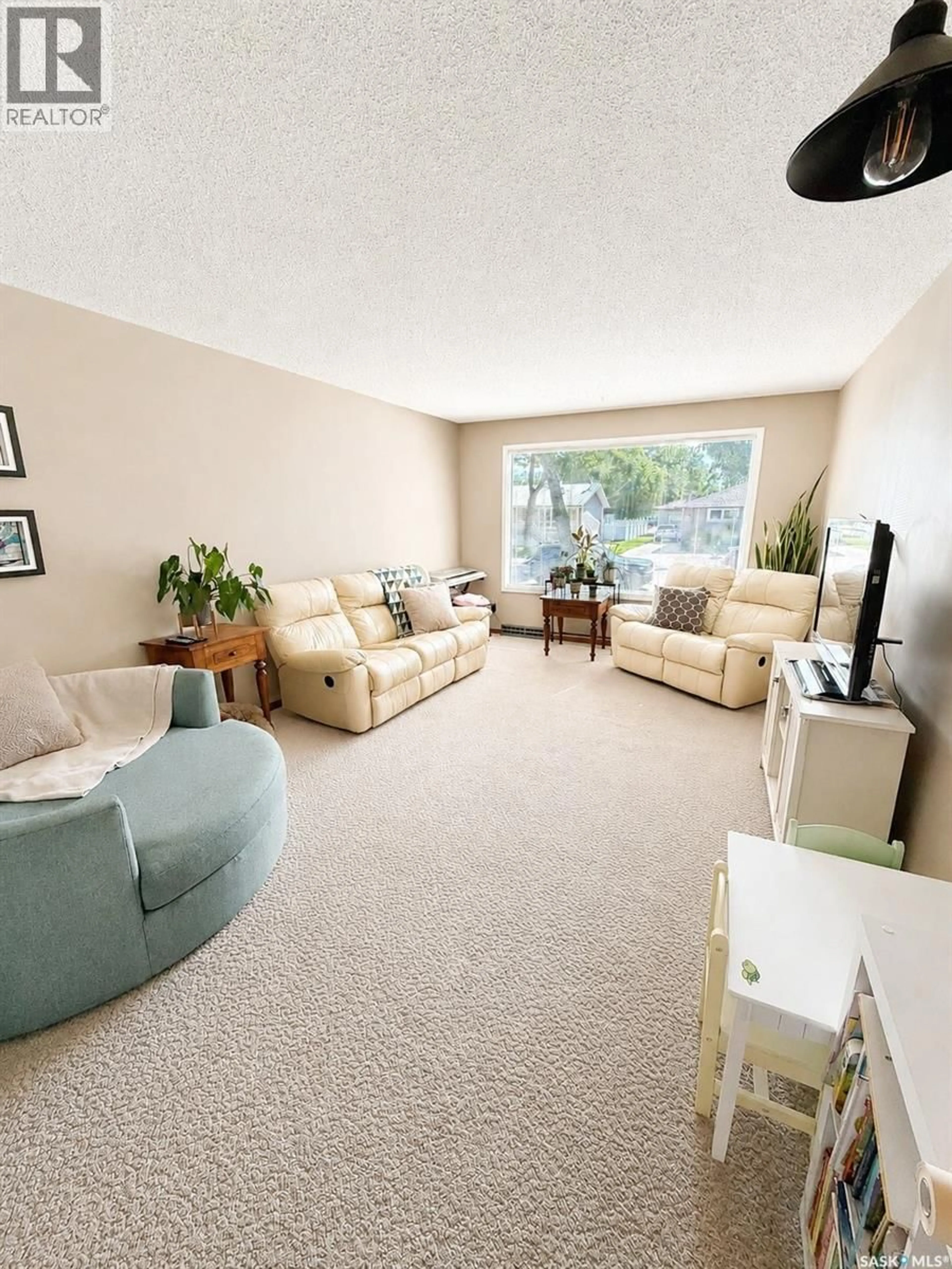 Living room with furniture, carpet floor for 4266 PRICE AVENUE, Gull Lake Saskatchewan S0N1A0
