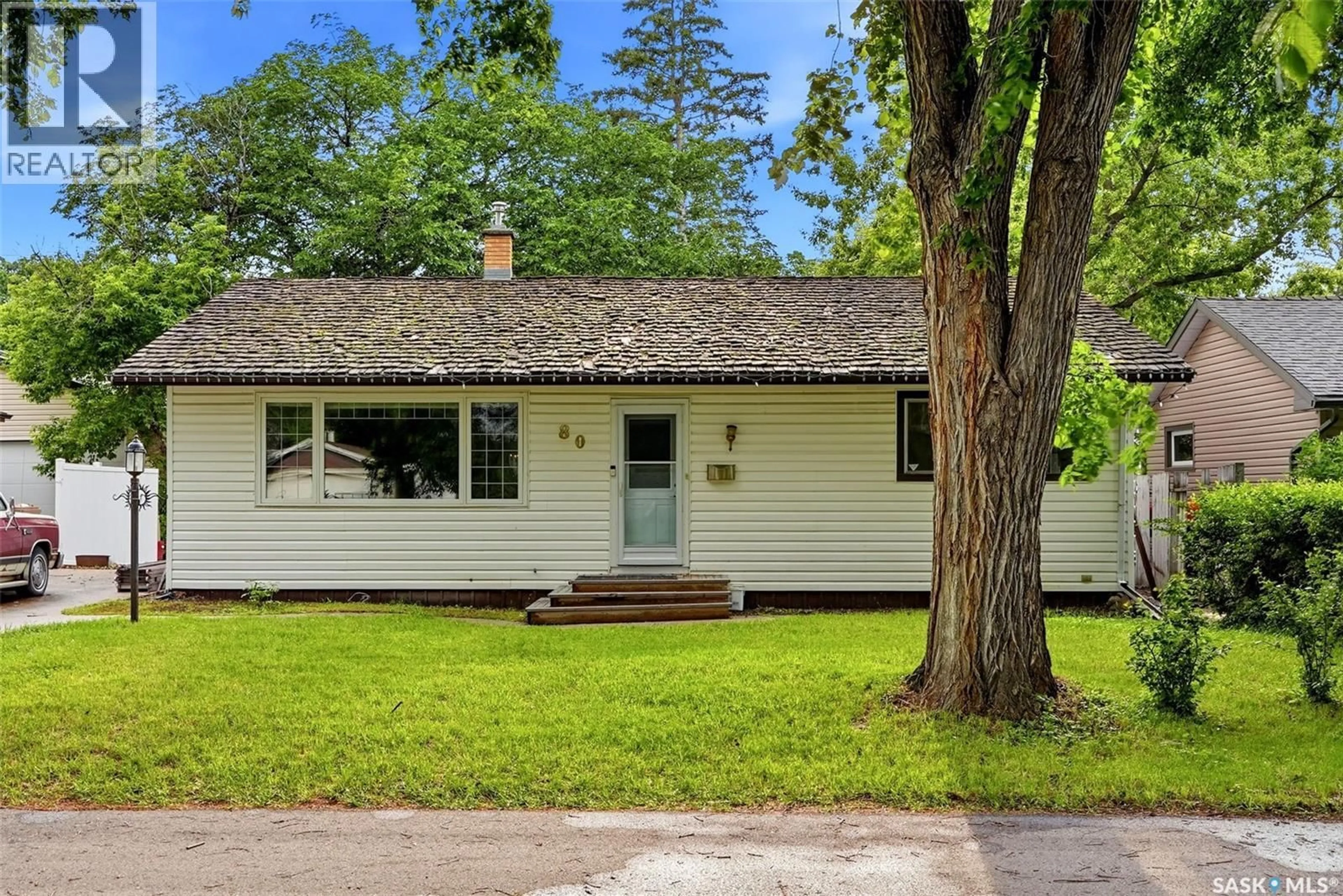 Home with vinyl exterior material, street for 80 BOBOLINK BAY, Regina Saskatchewan S4S4K1