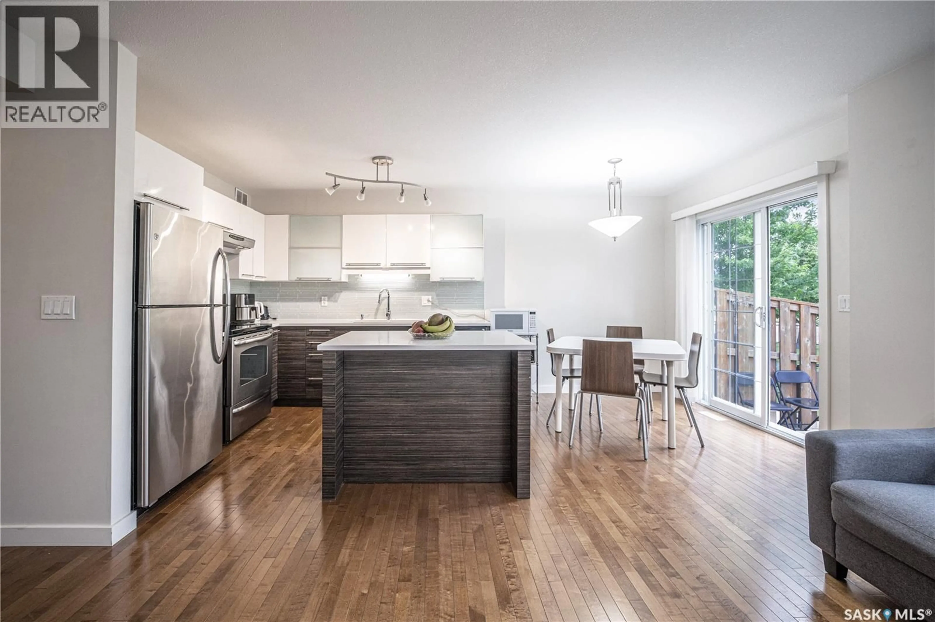 Open concept kitchen, wood/laminate floor for 307 - 710 GORDON ROAD, Saskatoon Saskatchewan S7T0J5