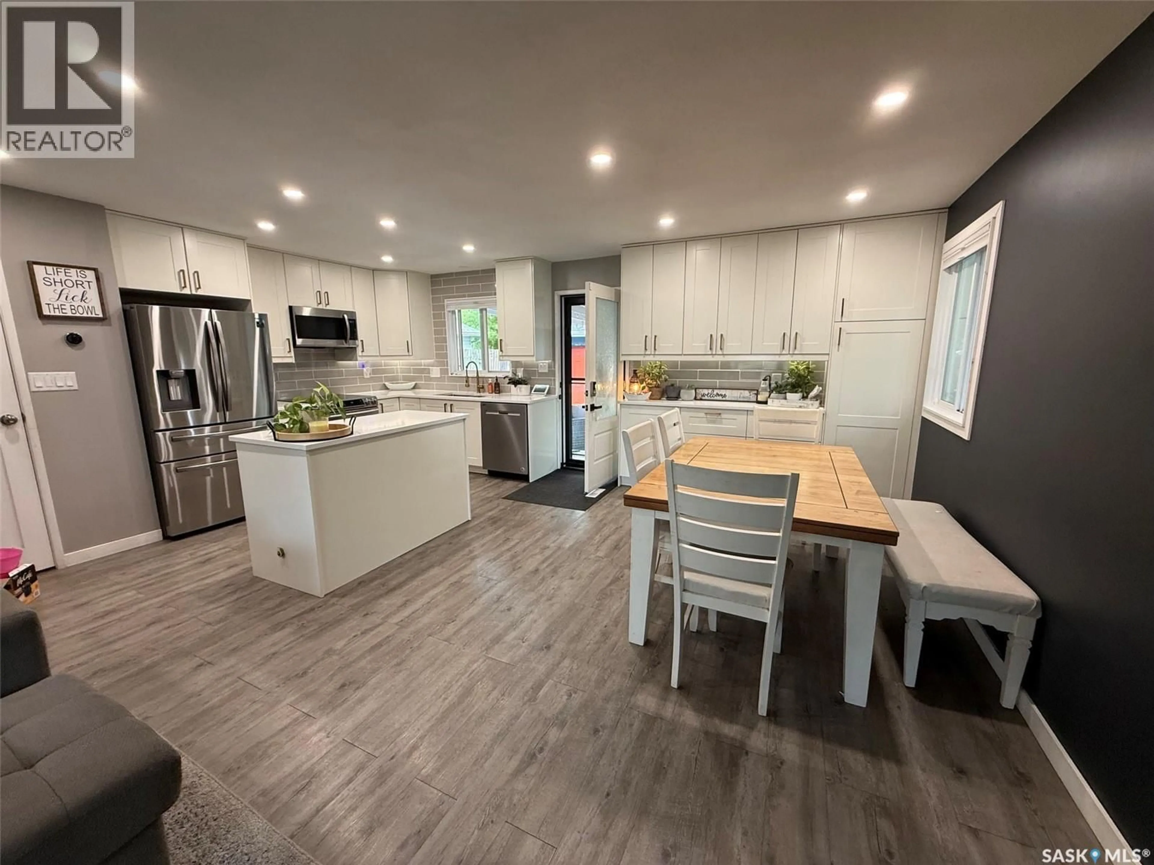 Open concept kitchen, wood/laminate floor for 34 WESSEL BAY, Regina Saskatchewan S4R5K7