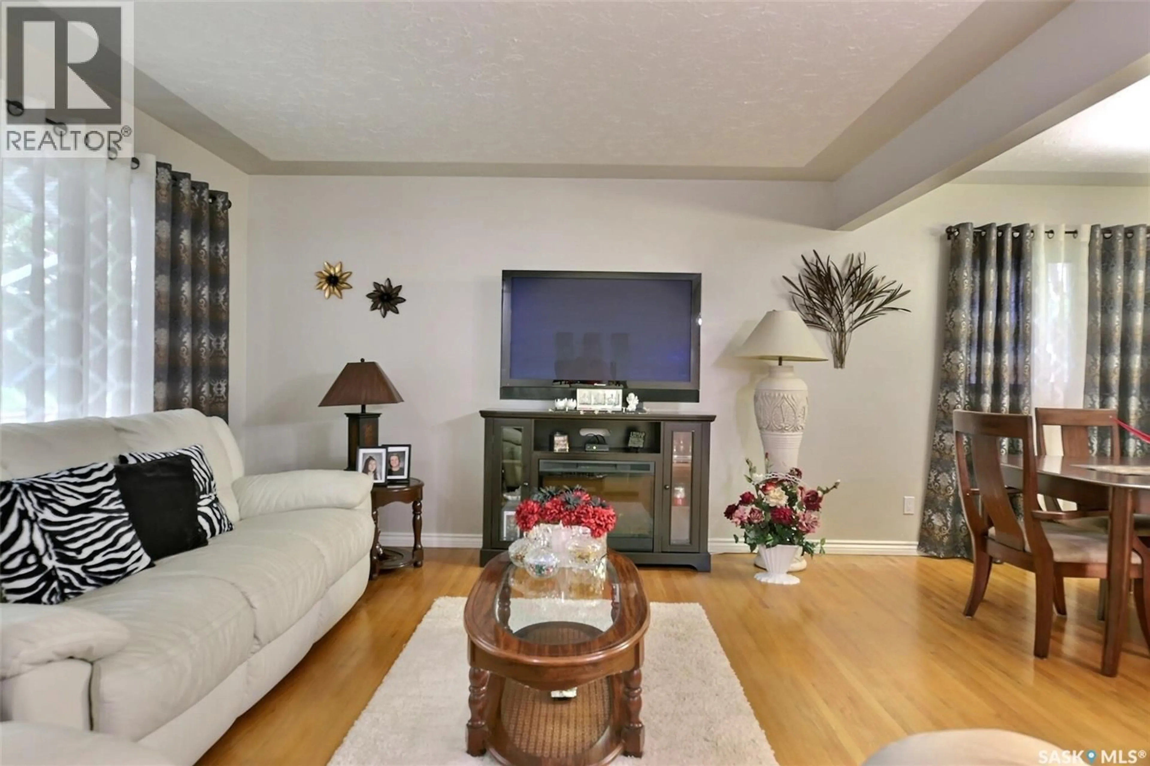 Living room with furniture, wood/laminate floor for 204 RAE STREET, Regina Saskatchewan S4R3L8