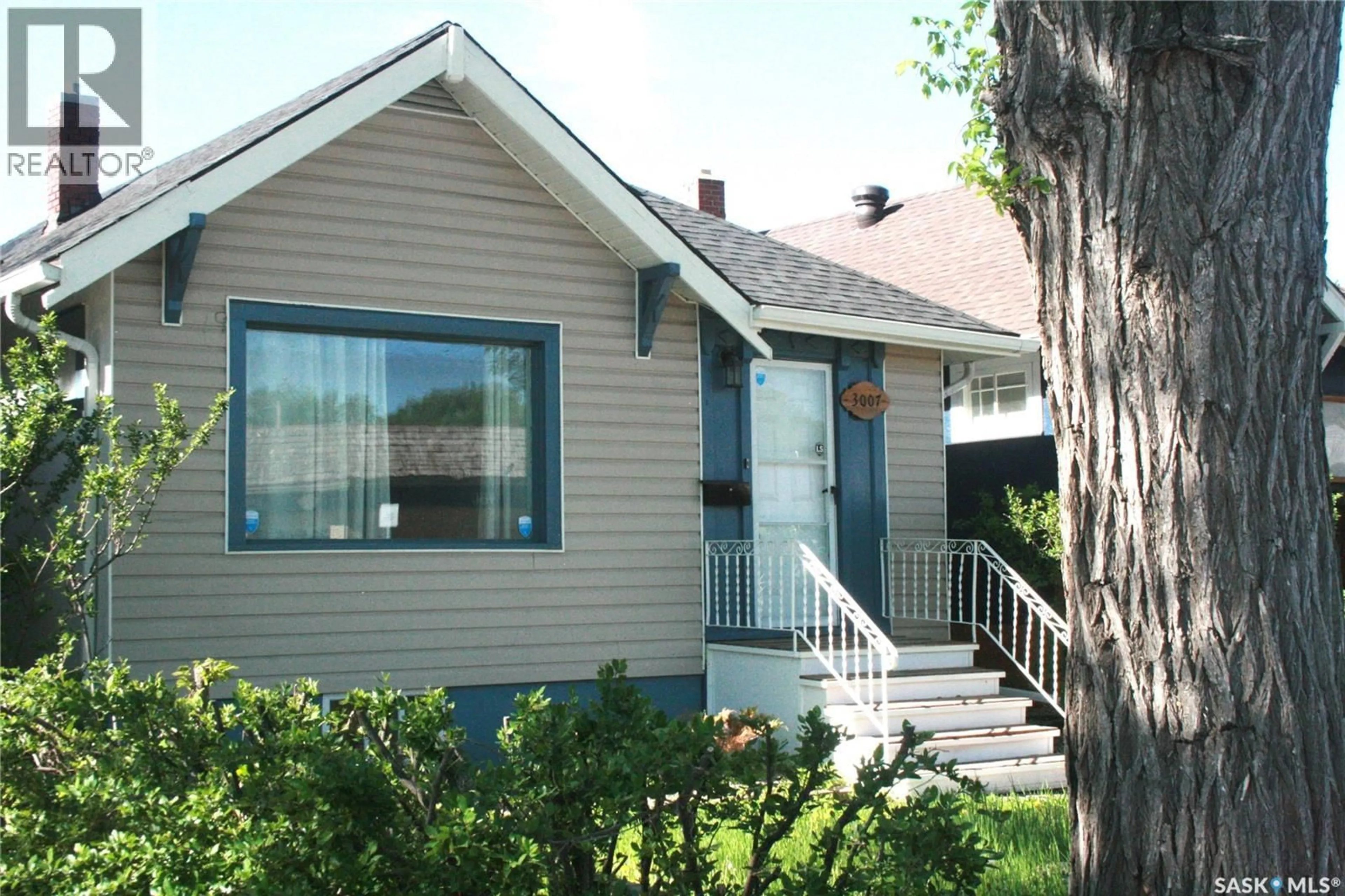 Home with vinyl exterior material, street for 3007 DEWDNEY AVENUE, Regina Saskatchewan S4T0Y3