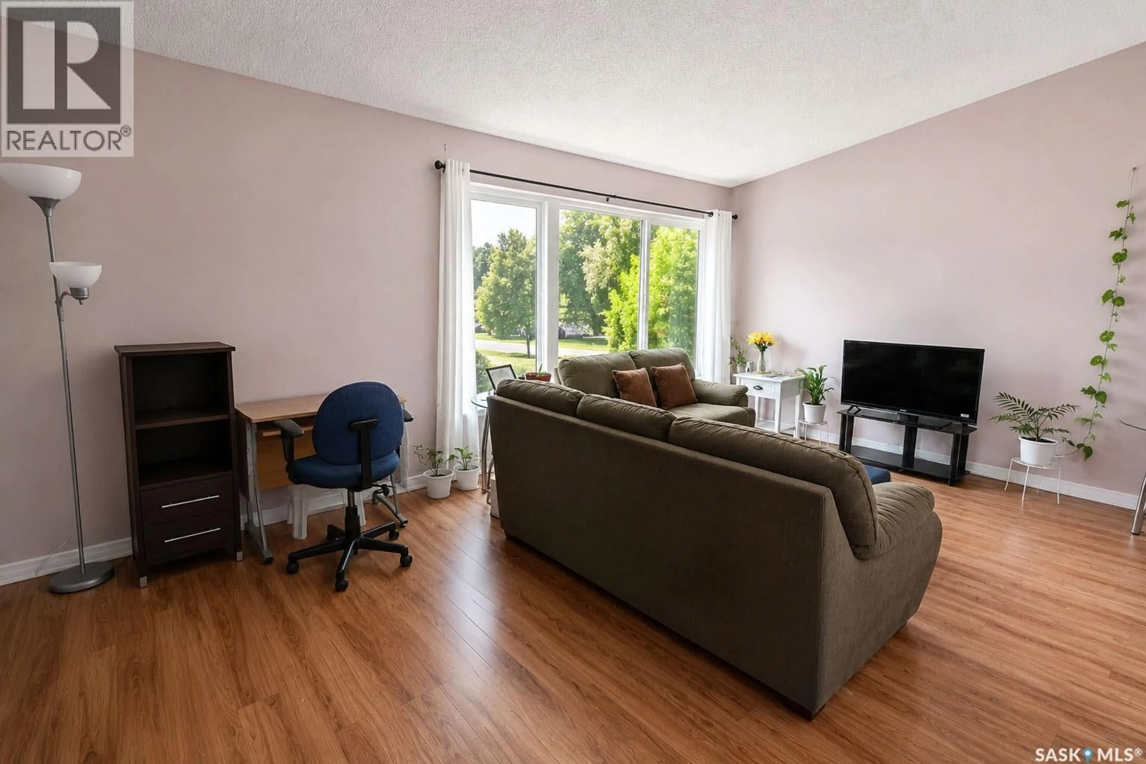 Living room with furniture, wood/laminate floor for 842-844 28TH STREET, Prince Albert Saskatchewan S6V1Y1