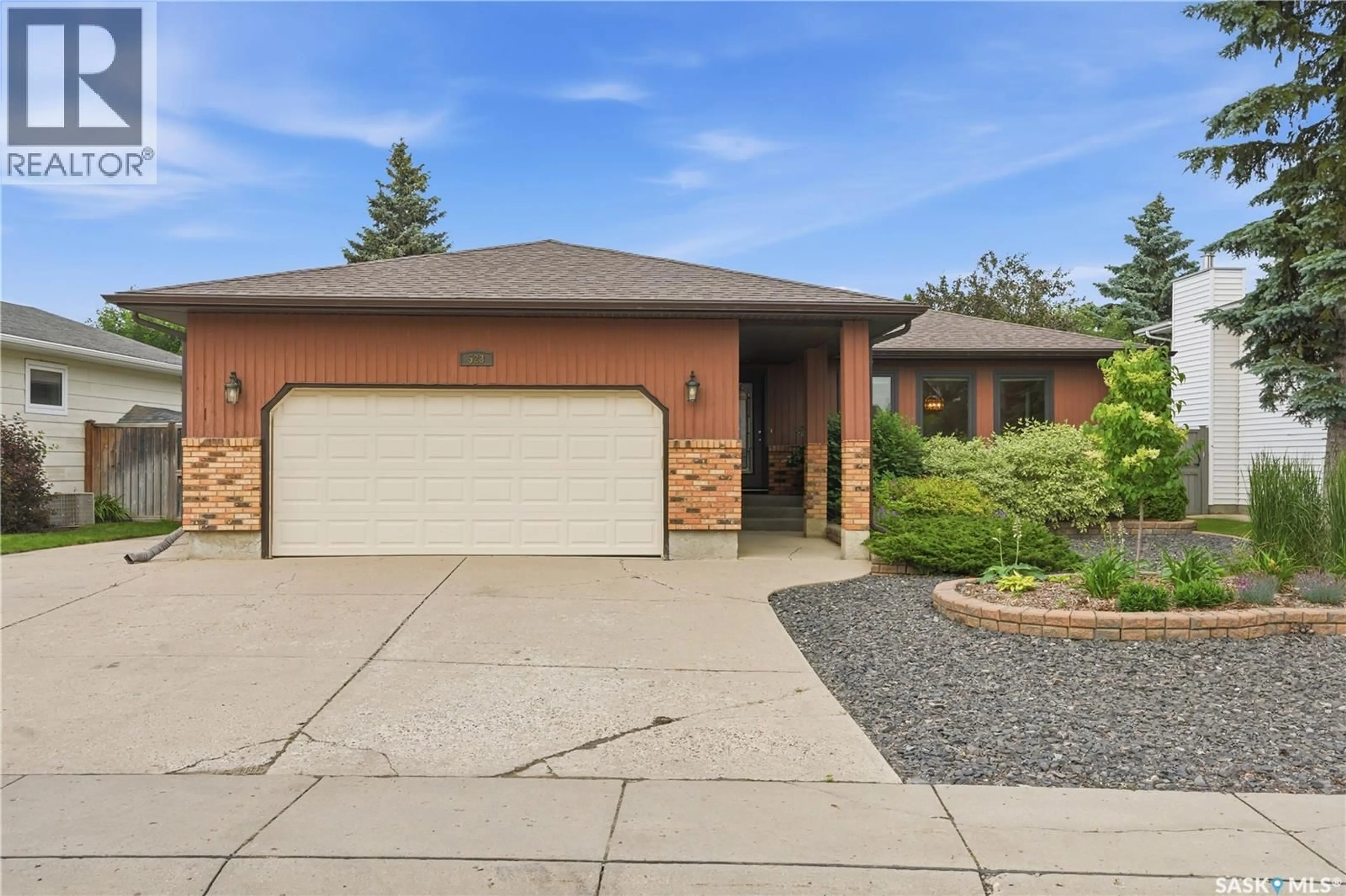 Home with brick exterior material, street for 523 SPENCER CRESCENT, Saskatoon Saskatchewan S7K7T5