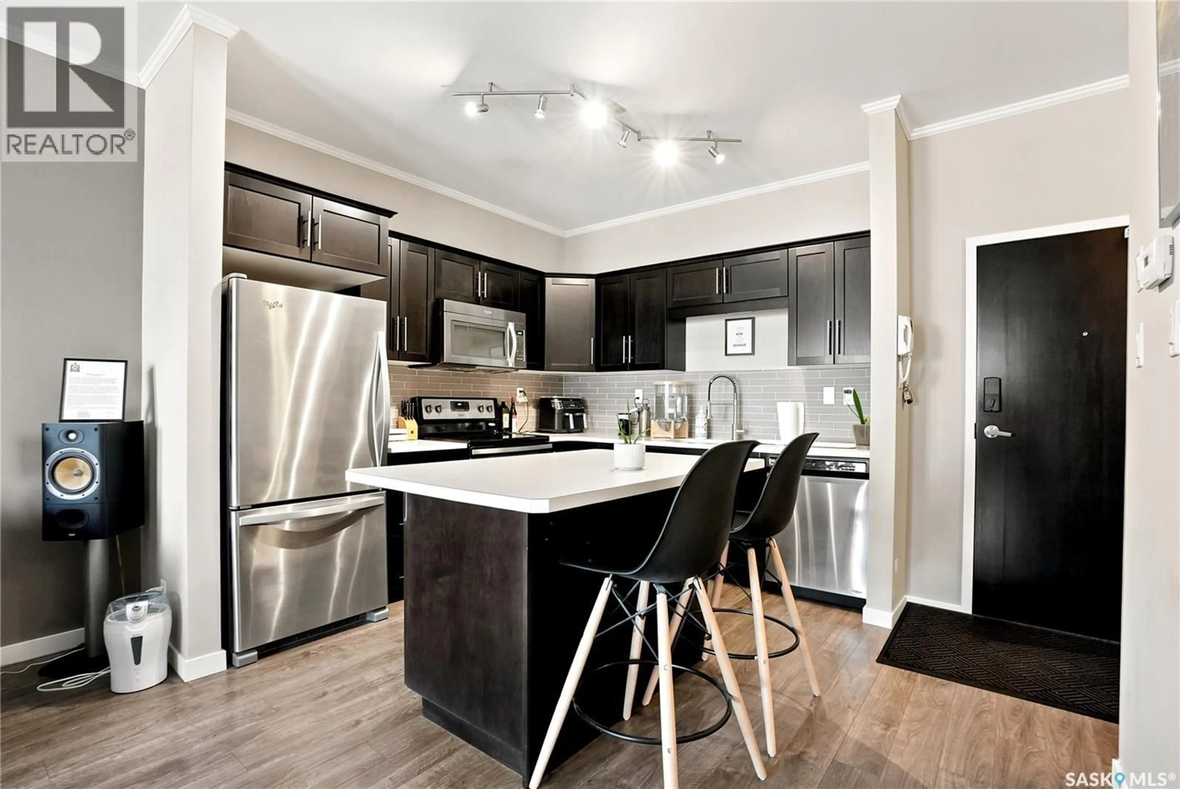Open concept kitchen, wood/laminate floor for 103 - 720 BALTZAN BOULEVARD, Saskatoon Saskatchewan S7W0W6