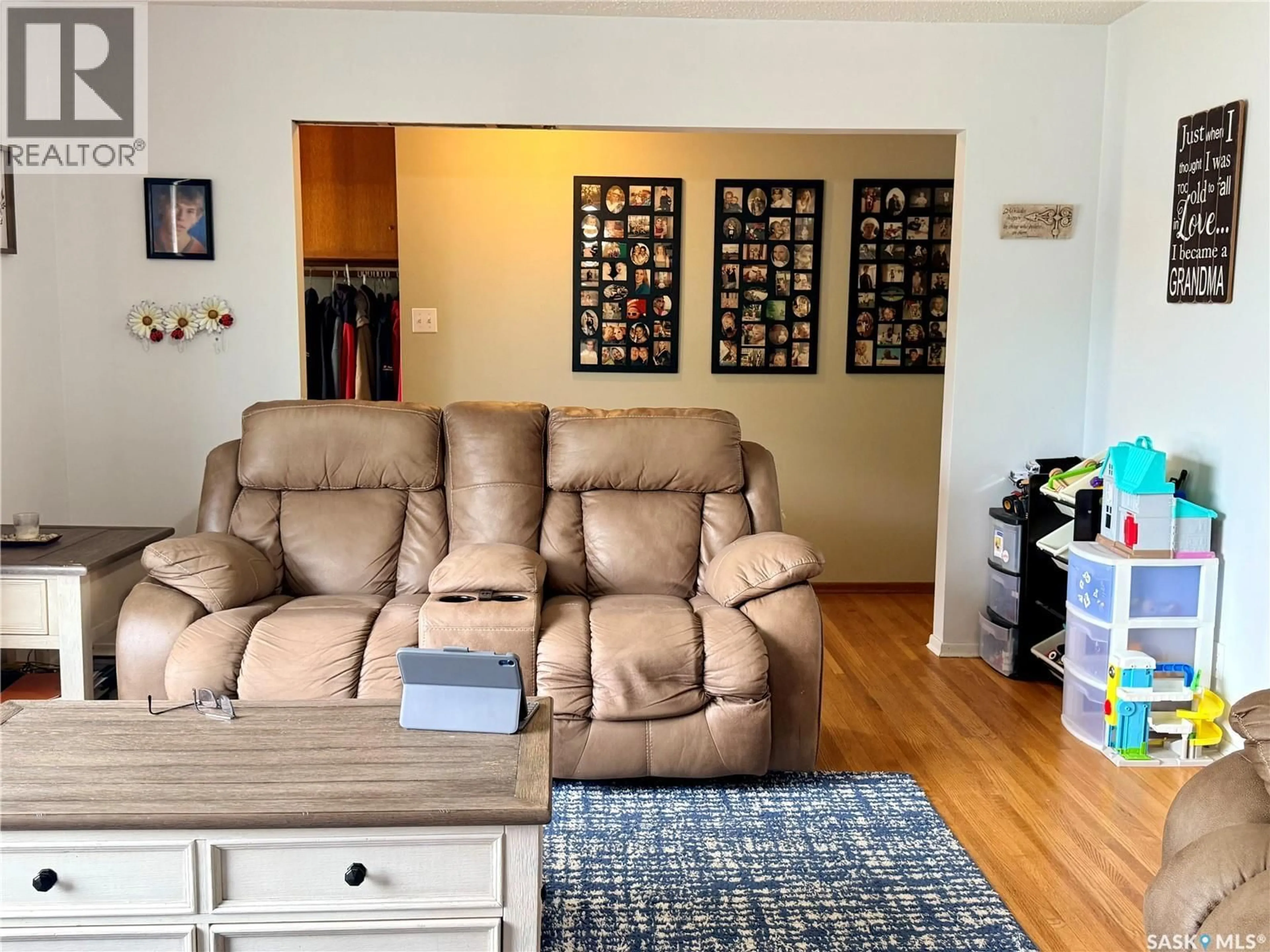 Living room with furniture, wood/laminate floor for 160 3RD AVENUE, Swift Current Saskatchewan S9H3K4