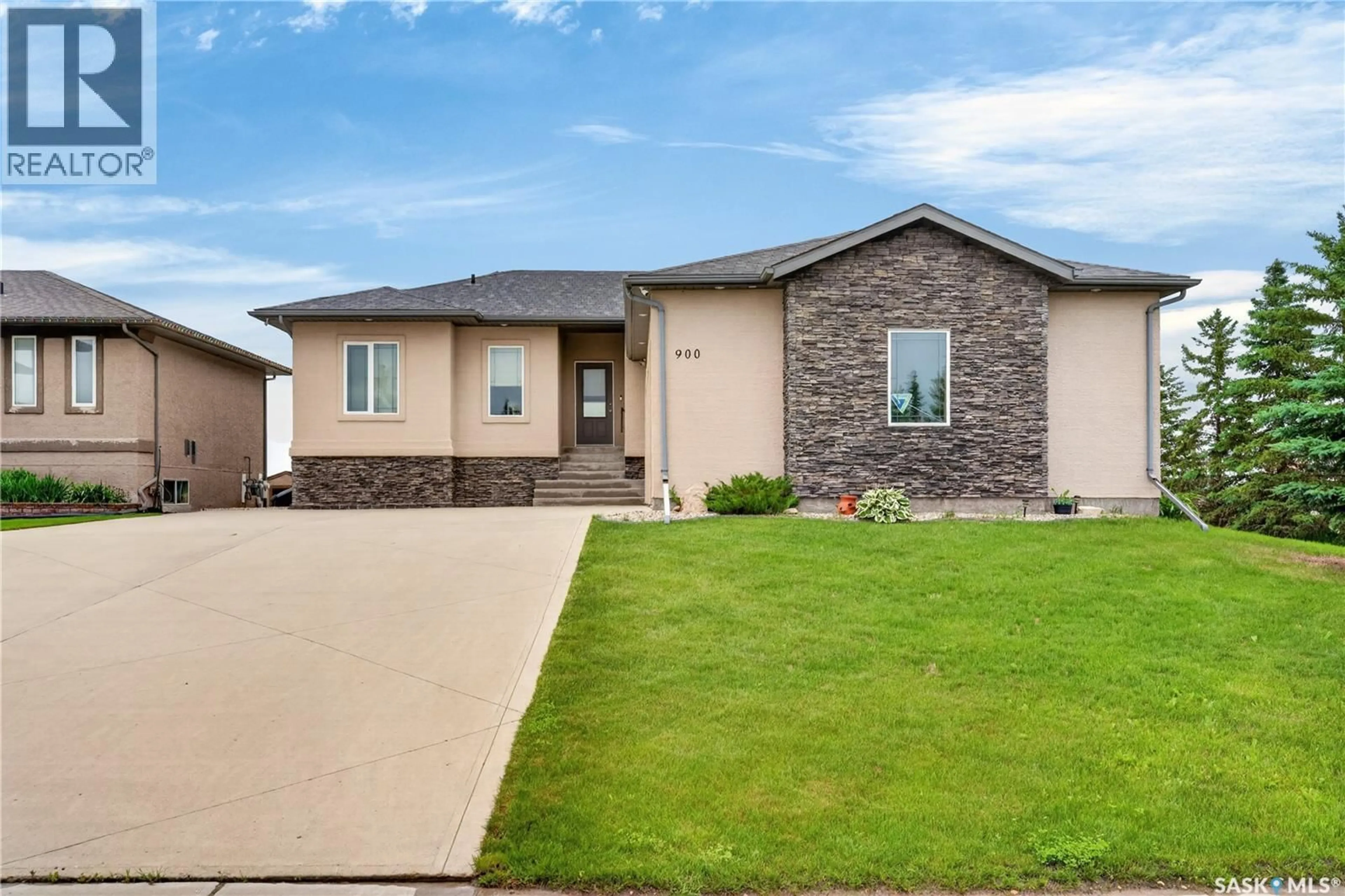 Home with brick exterior material, street for 900 WATER RIDGE CRESCENT, Humboldt Saskatchewan S0K2A0