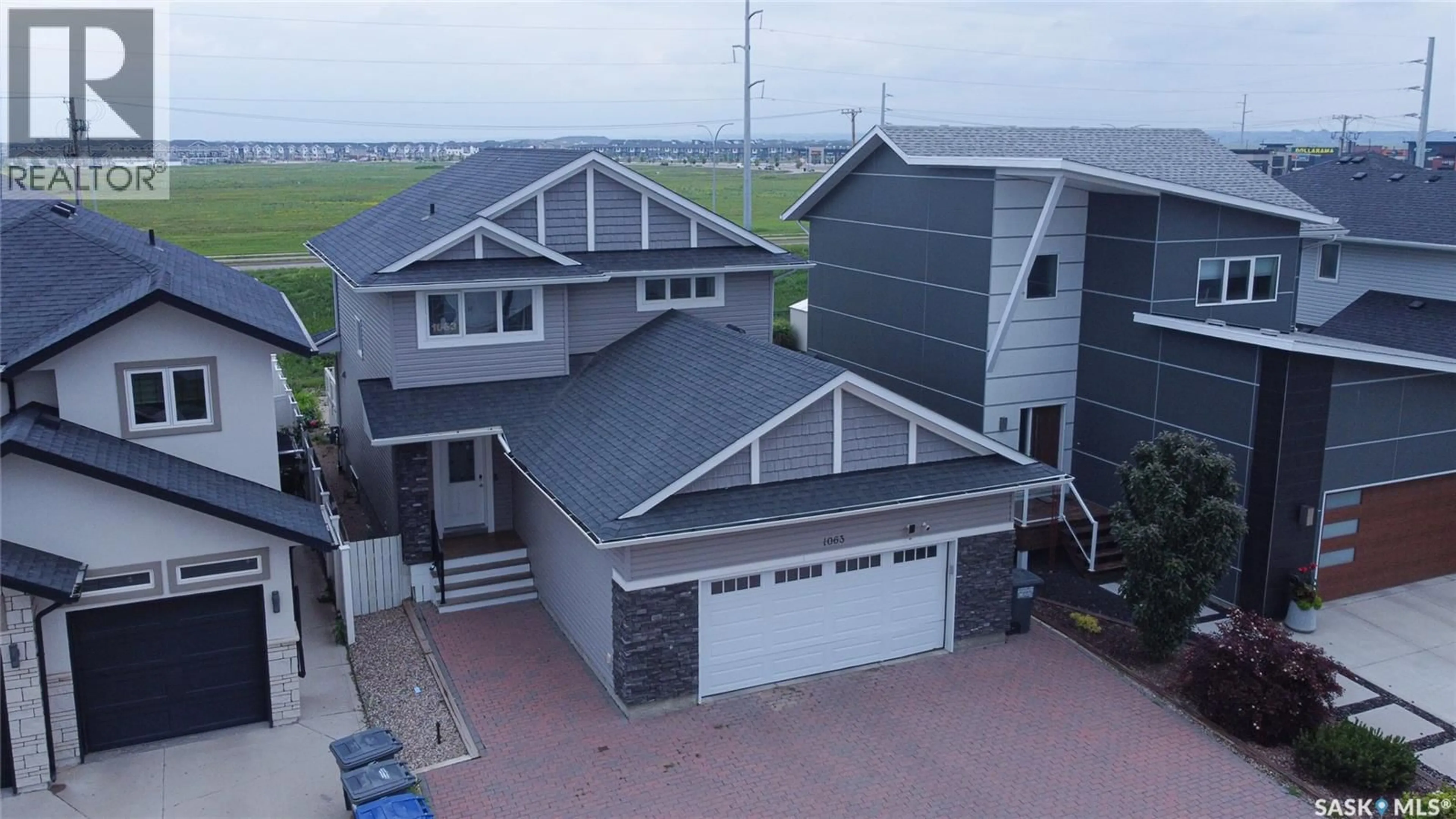 A pic from outside/outdoor area/front of a property/back of a property/a pic from drone, unknown for 1063 GLACIAL SHORES COMMON, Saskatoon Saskatchewan S7W0R2