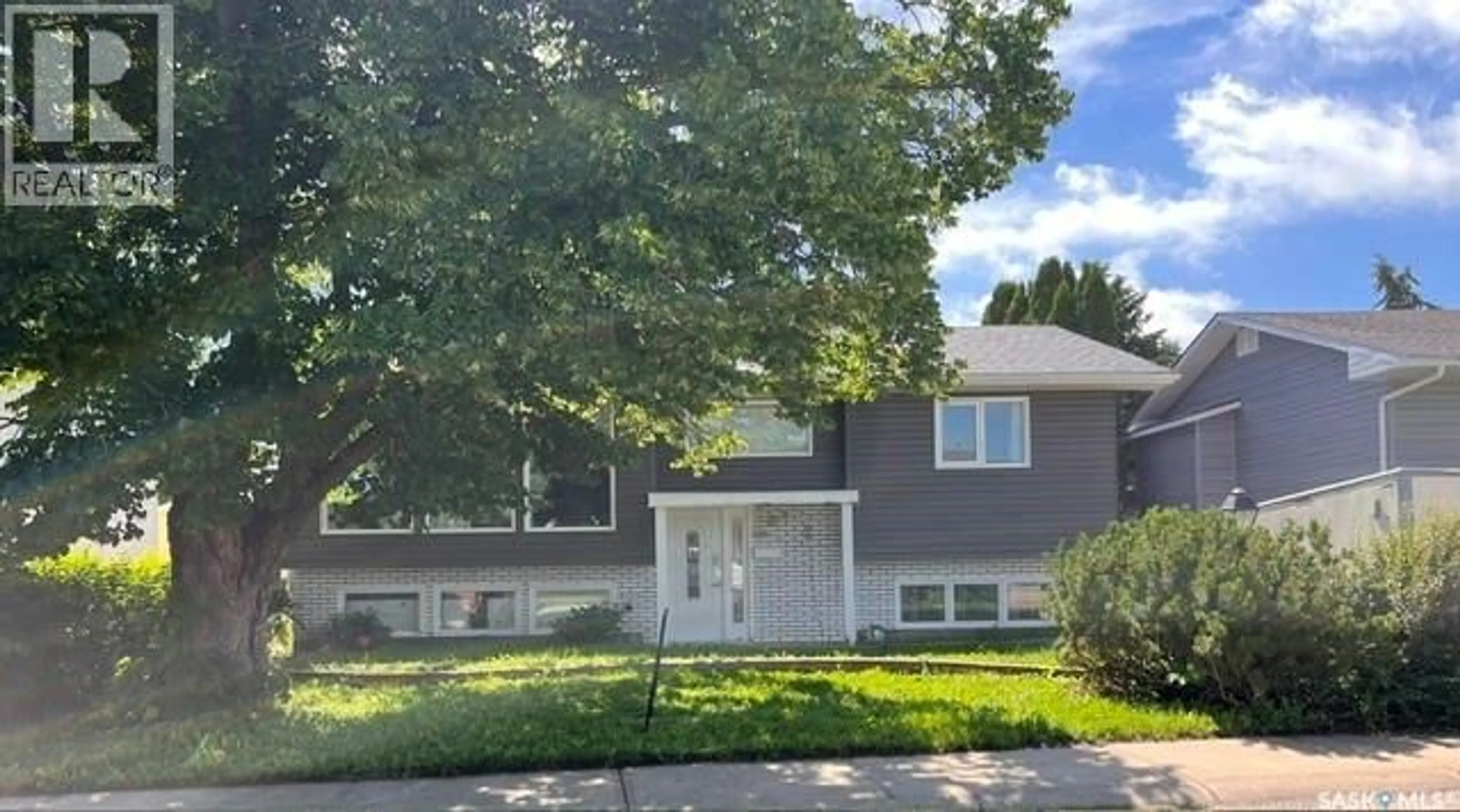 Home with vinyl exterior material, street for 1321 PRINCE CRESCENT, Moose Jaw Saskatchewan S6H6E6