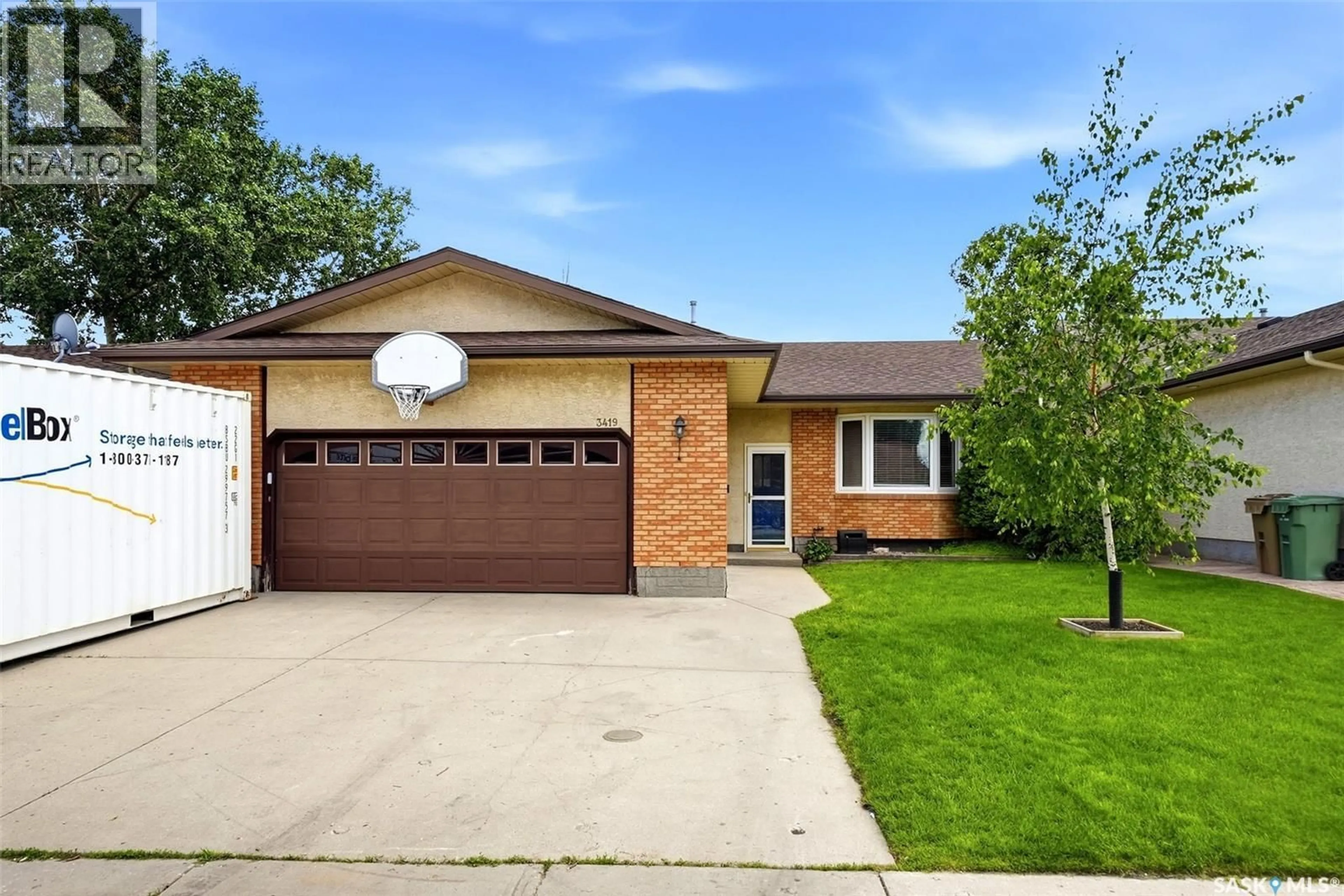 Home with brick exterior material, street for 3419 OLIVE GROVE, Regina Saskatchewan S4V2P2