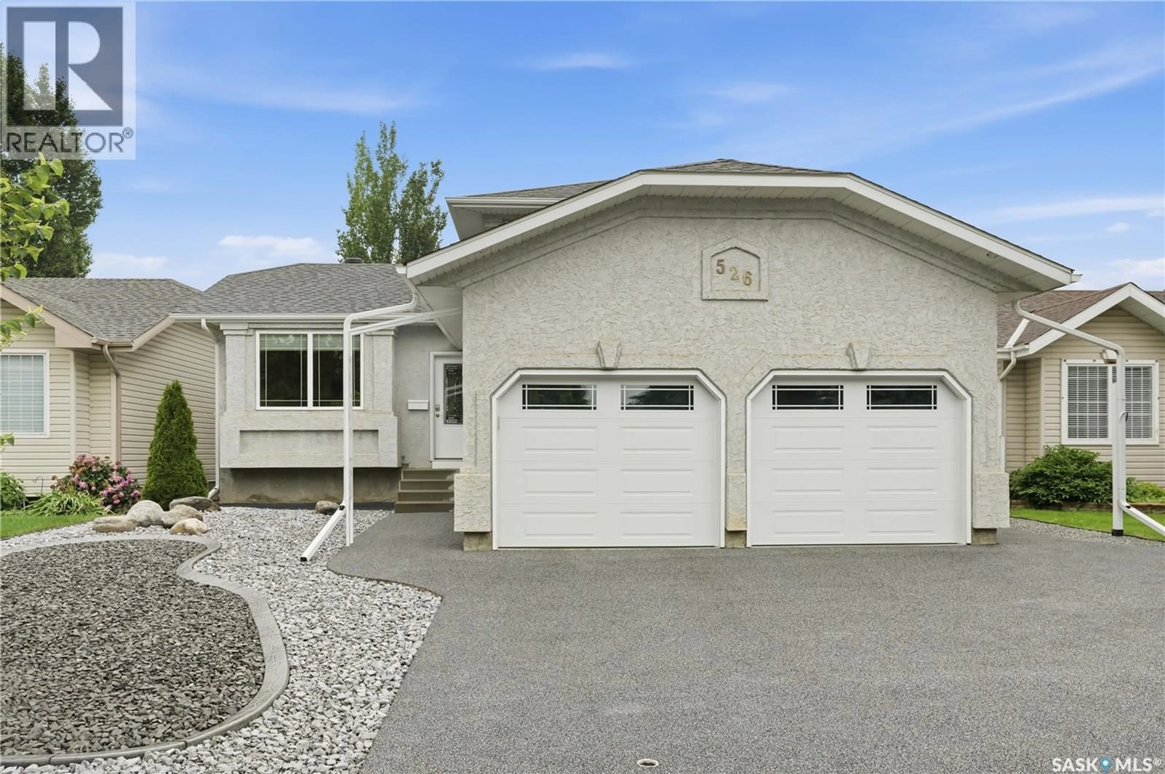 Home with vinyl exterior material, street for 526 MCWILLIE AVENUE, Saskatoon Saskatchewan S7S1B6