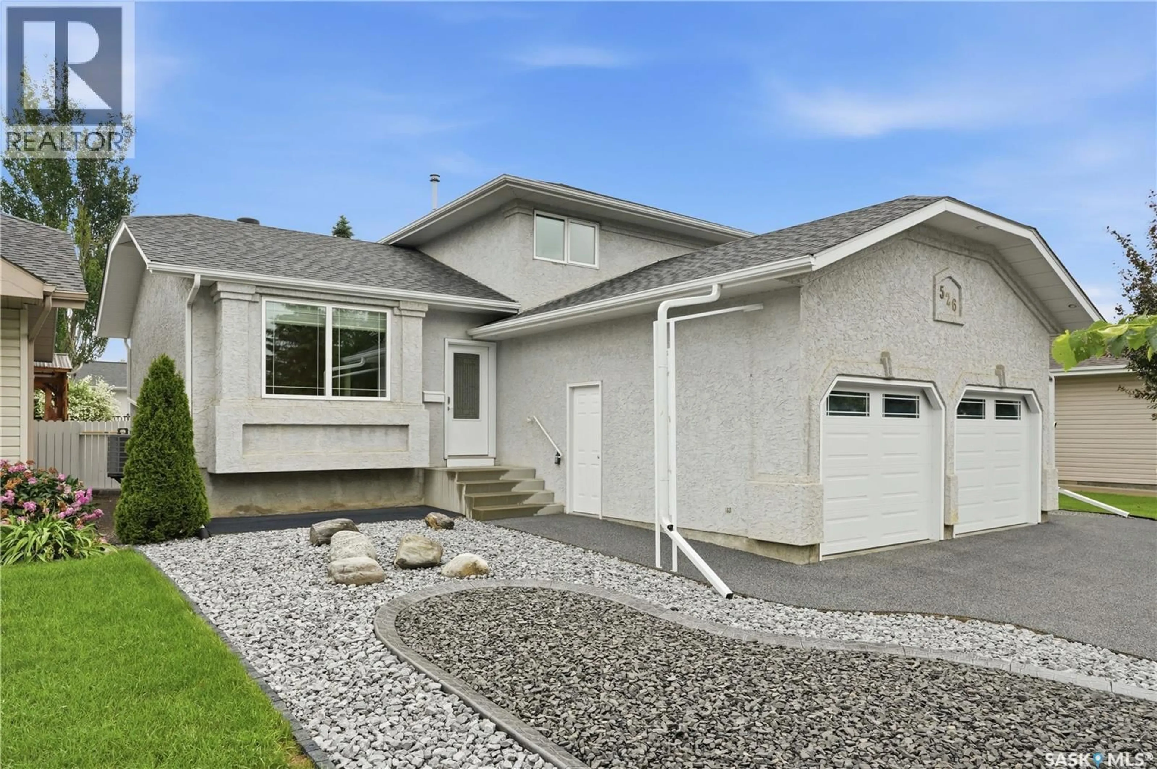 Home with vinyl exterior material, street for 526 MCWILLIE AVENUE, Saskatoon Saskatchewan S7S1B6