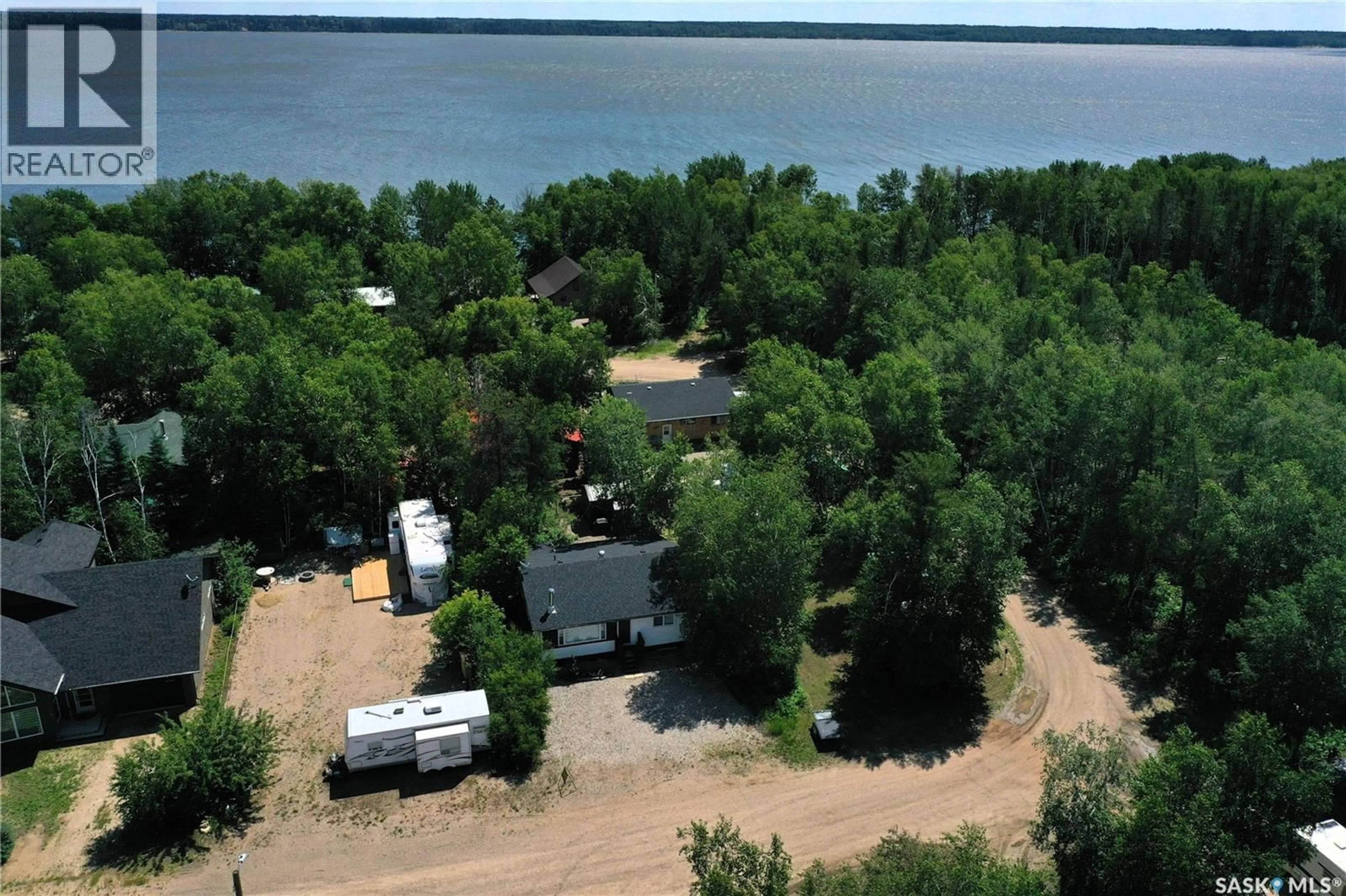 A pic from outside/outdoor area/front of a property/back of a property/a pic from drone, water/lake/river/ocean view for 217 BIRCH DRIVE, Tobin Lake Saskatchewan S0J3B0