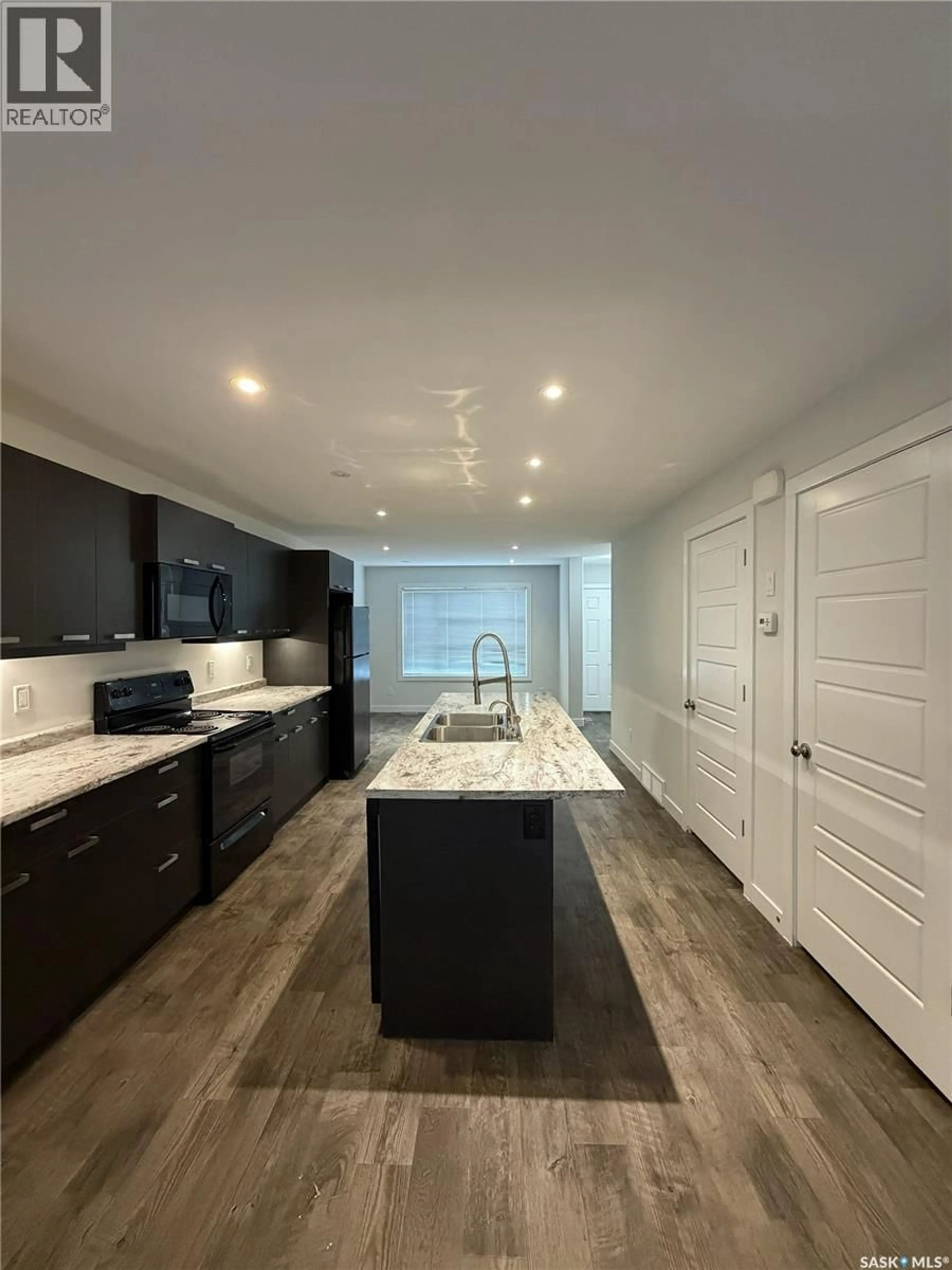 Open concept kitchen, ceramic/tile floor for 2043 BRODER STREET, Regina Saskatchewan S4N3S3