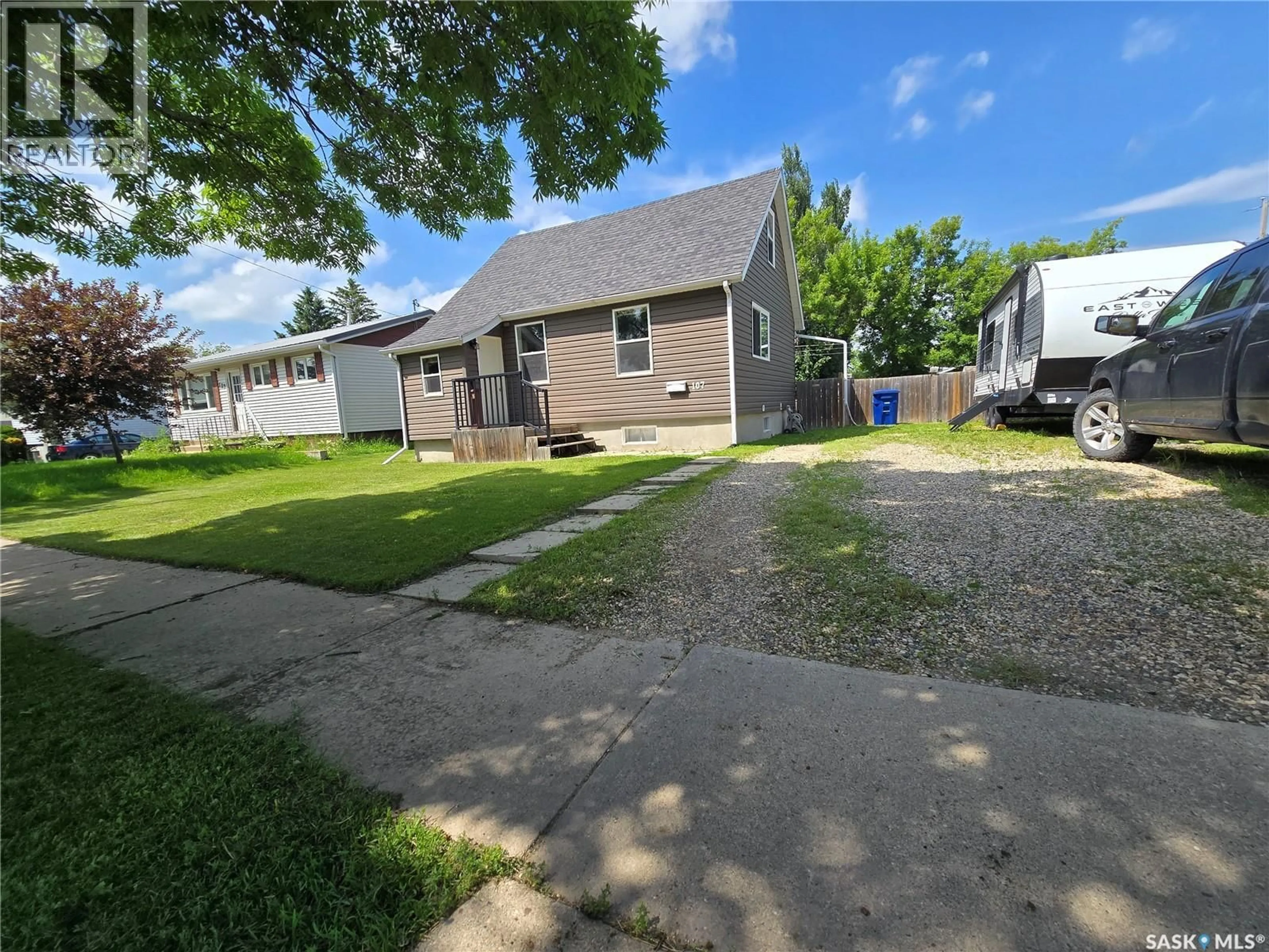 A pic from outside/outdoor area/front of a property/back of a property/a pic from drone, street for 107 9TH AVENUE, Weyburn Saskatchewan S4H1Z6