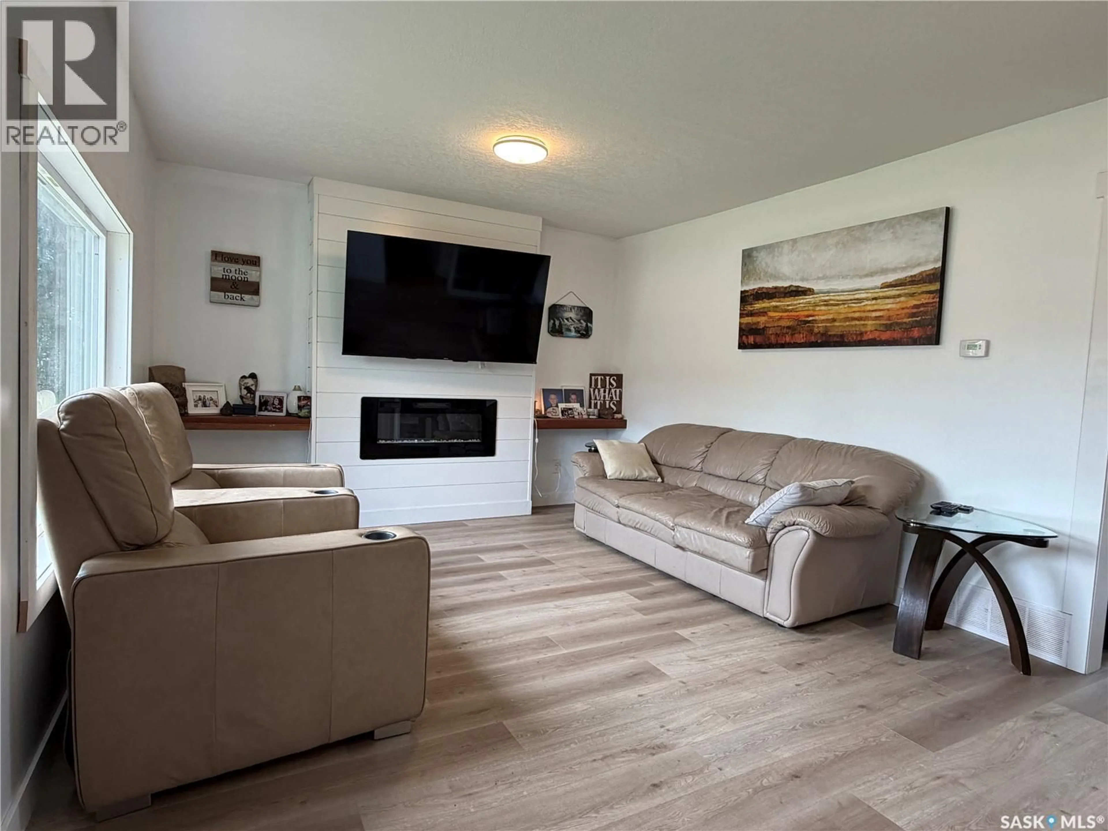 Living room with furniture, wood/laminate floor for 314 MAIN STREET, Langham Saskatchewan S0K2L0