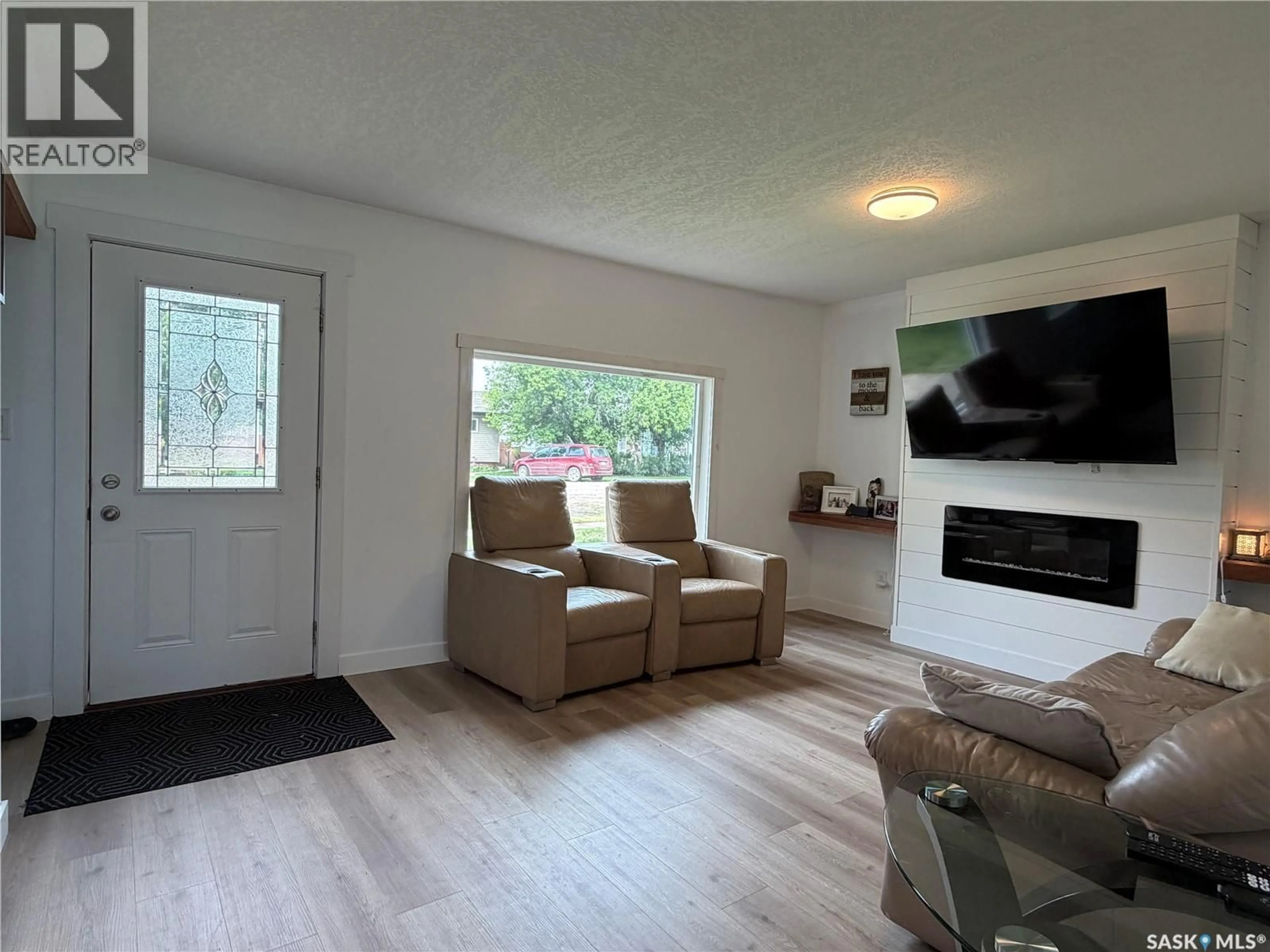 Living room with furniture, wood/laminate floor for 314 MAIN STREET, Langham Saskatchewan S0K2L0
