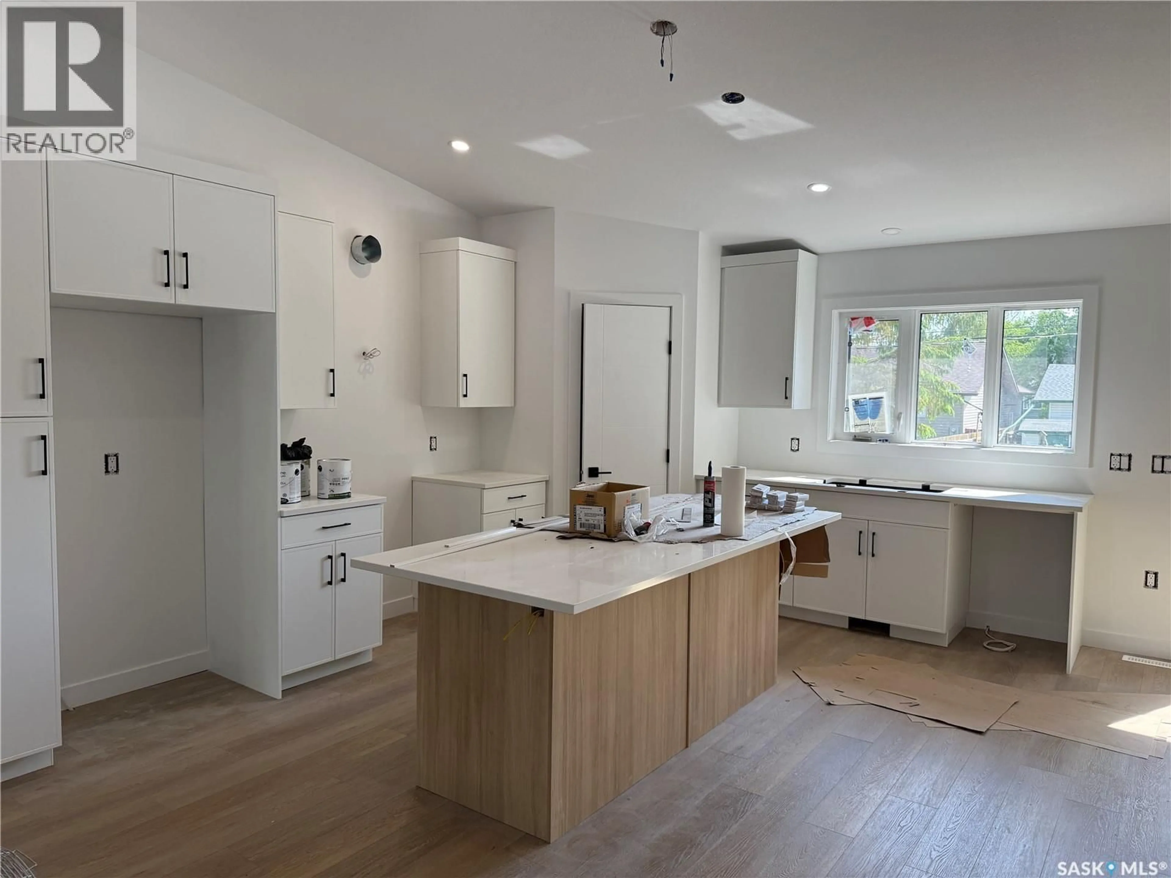 Open concept kitchen, wood/laminate floor for 620 14TH STREET, Humboldt Saskatchewan S0K2A0