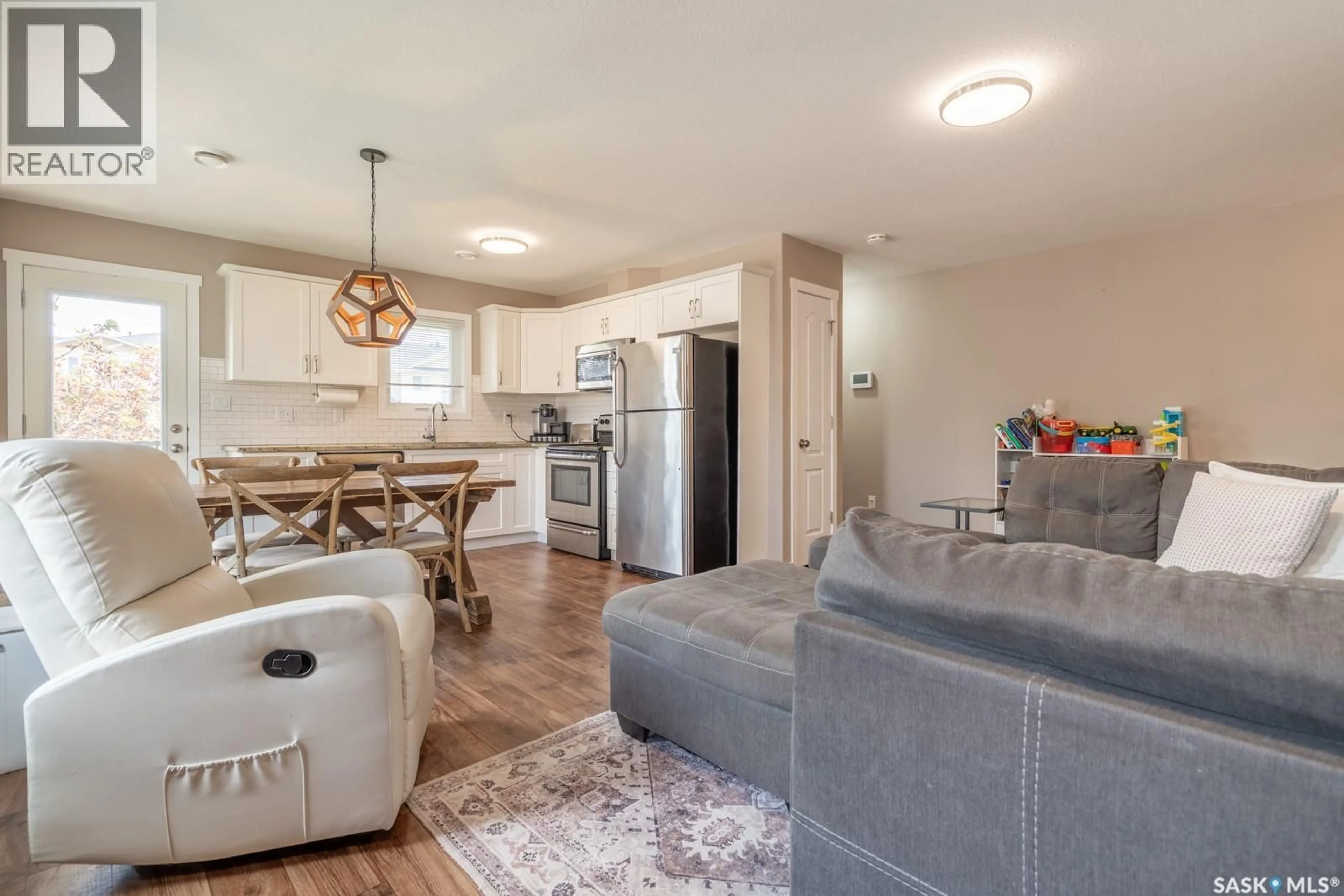Open concept kitchen, wood/laminate floor for 317 - 1225 EMPRESS STREET, Regina Saskatchewan S4T1G7