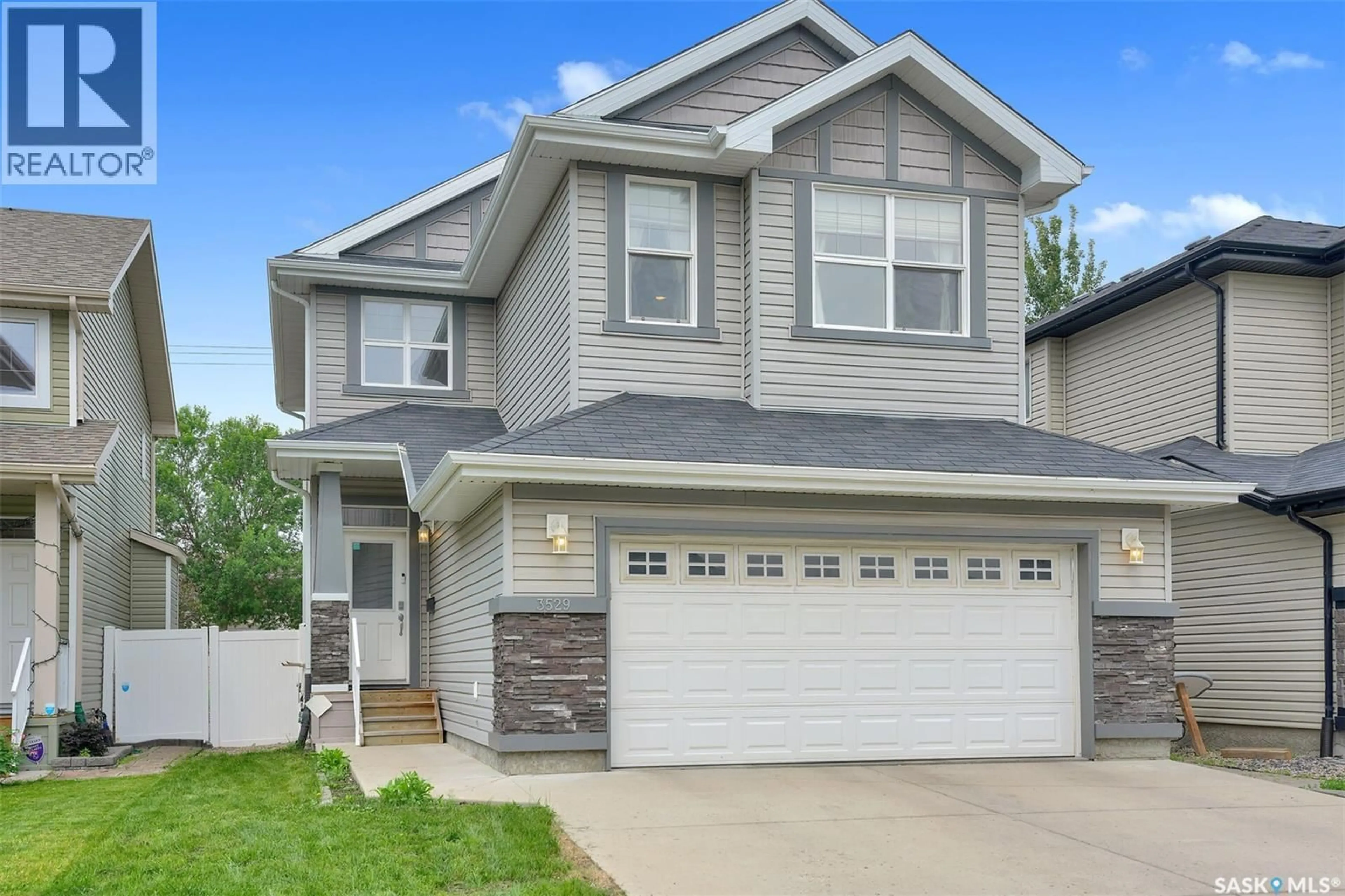 Home with vinyl exterior material, street for 3529 GREEN MOSS LANE, Regina Saskatchewan S4V1L5