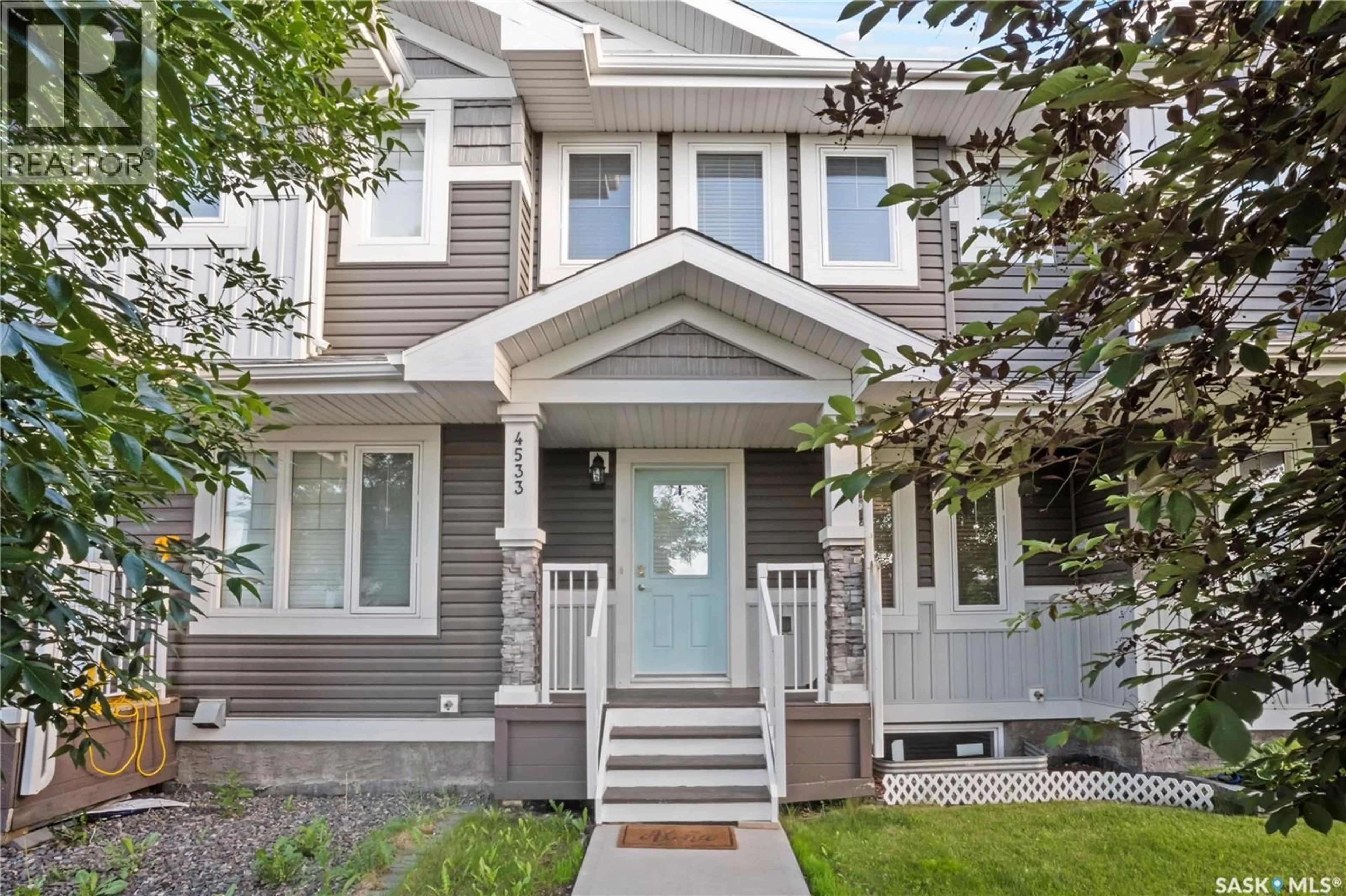 Home with vinyl exterior material, street for E - 4533 PRIMROSE GREEN DRIVE, Regina Saskatchewan S4V3K4