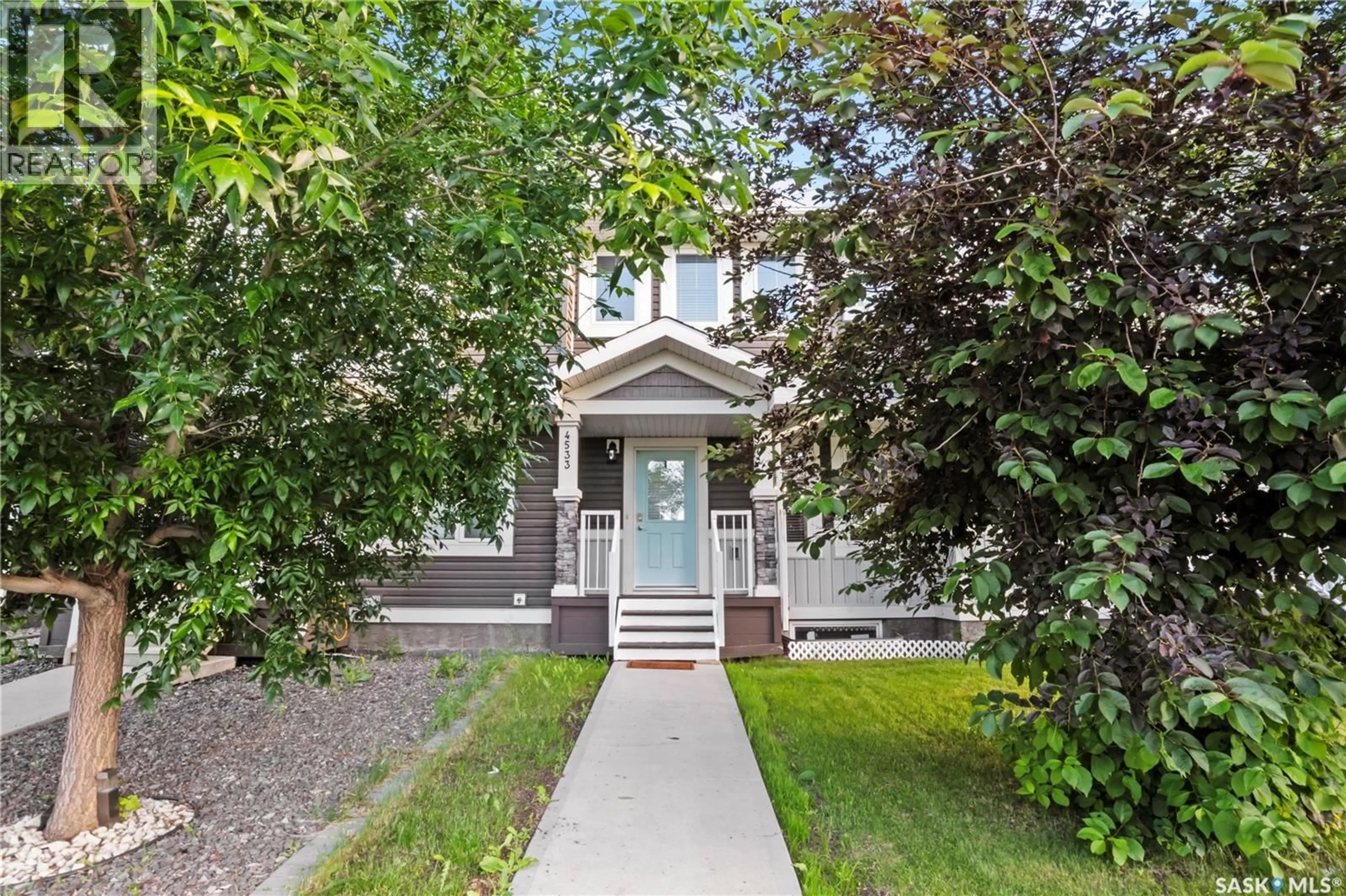 Home with vinyl exterior material, street for E - 4533 PRIMROSE GREEN DRIVE, Regina Saskatchewan S4V3K4