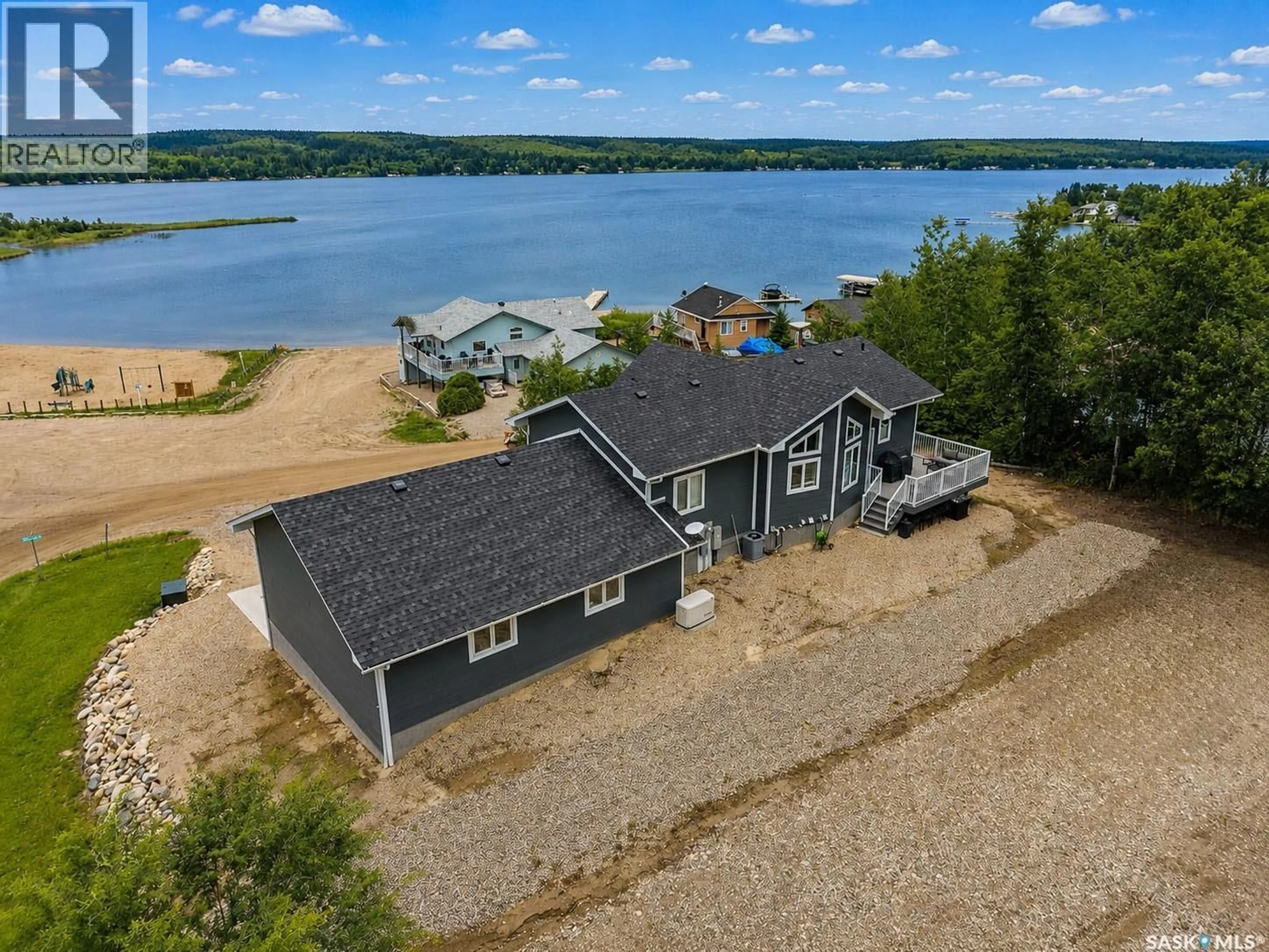 A pic from outside/outdoor area/front of a property/back of a property/a pic from drone, water/lake/river/ocean view for 101 JACOBSON DRIVE, Christopher Lake Saskatchewan S0J0N0