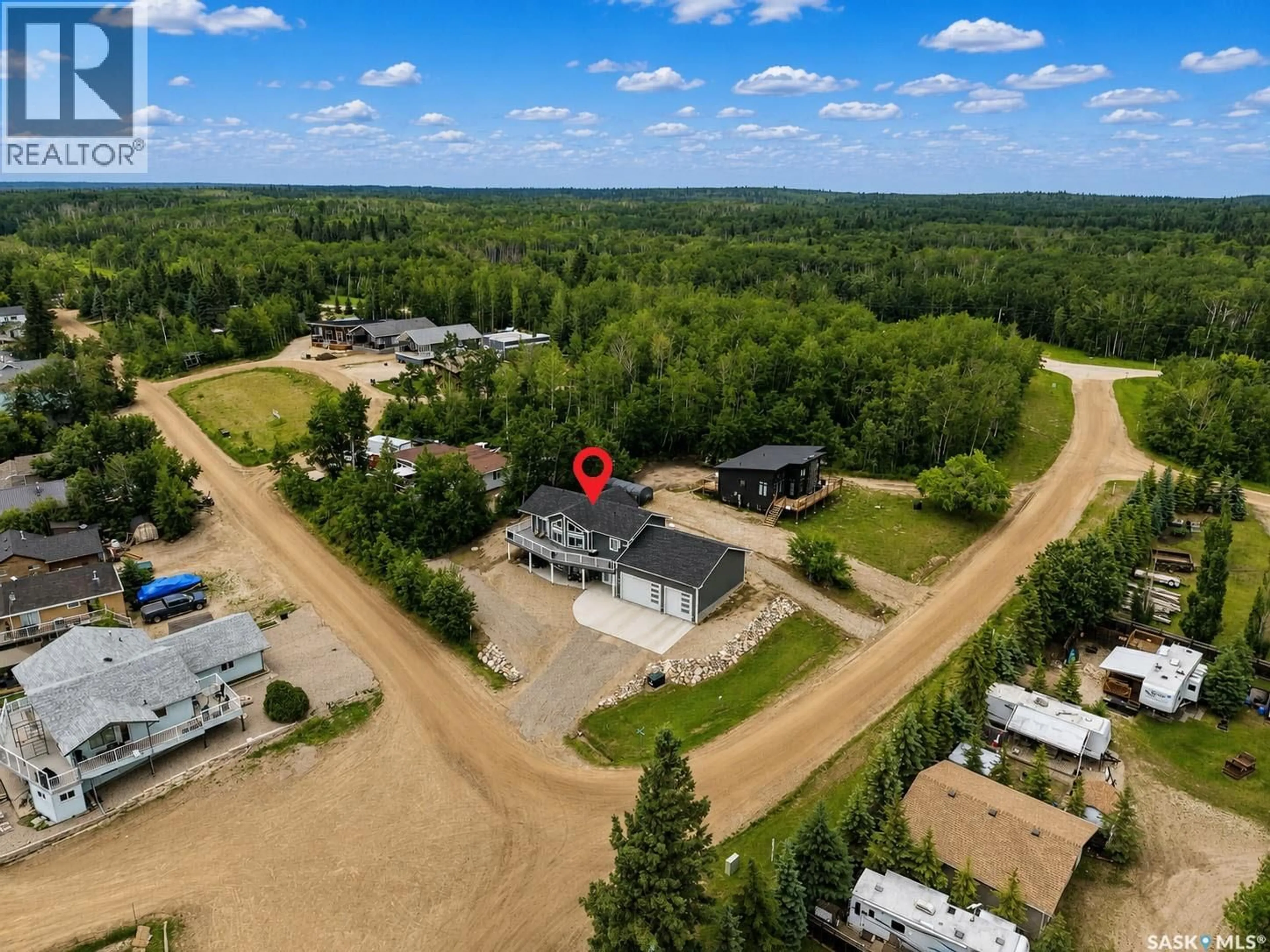 A pic from outside/outdoor area/front of a property/back of a property/a pic from drone, unknown for 101 JACOBSON DRIVE, Christopher Lake Saskatchewan S0J0N0