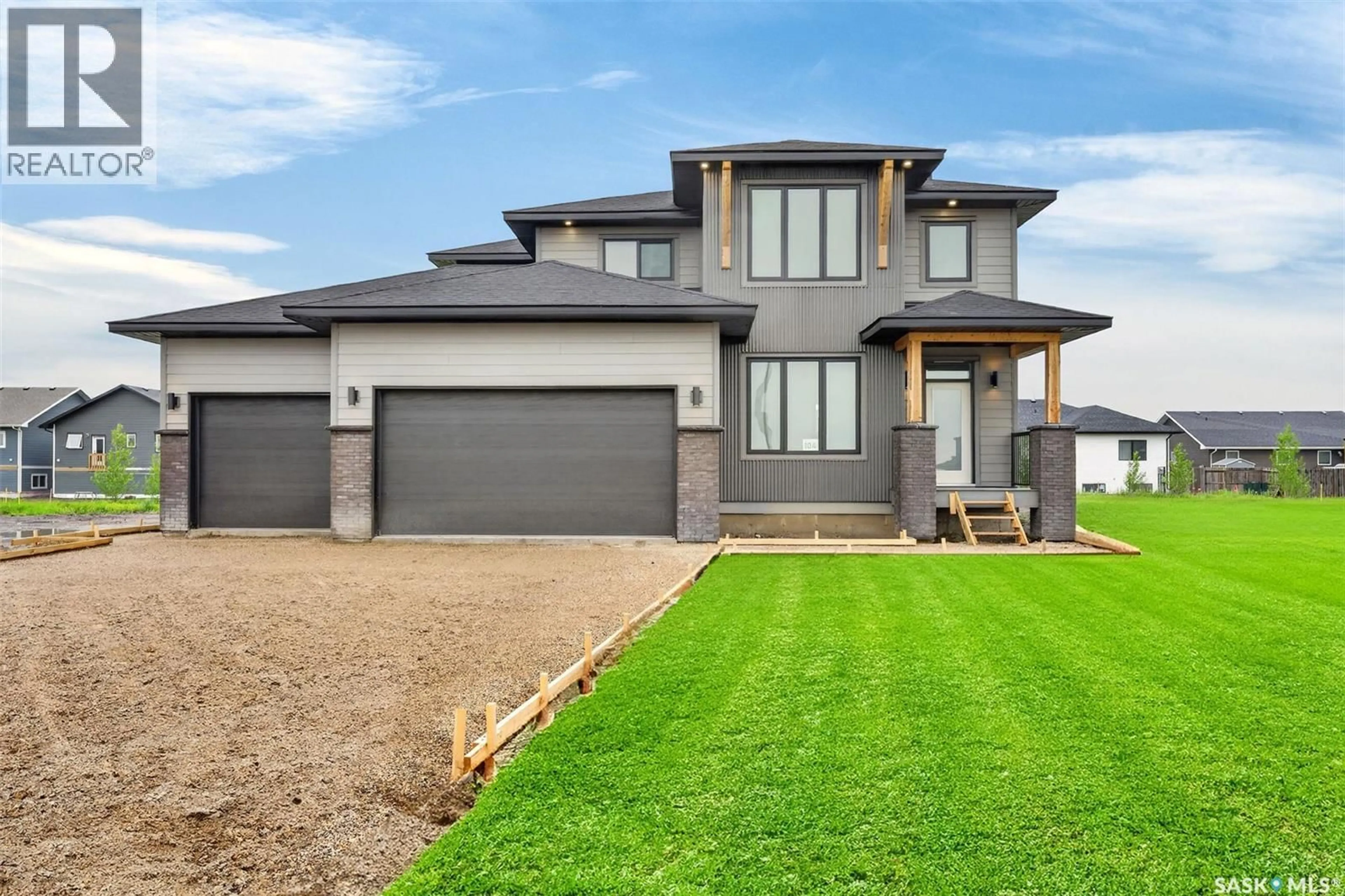 Home with brick exterior material, street for 104 LAKEWOOD DRIVE, Humboldt Saskatchewan S0K2A0