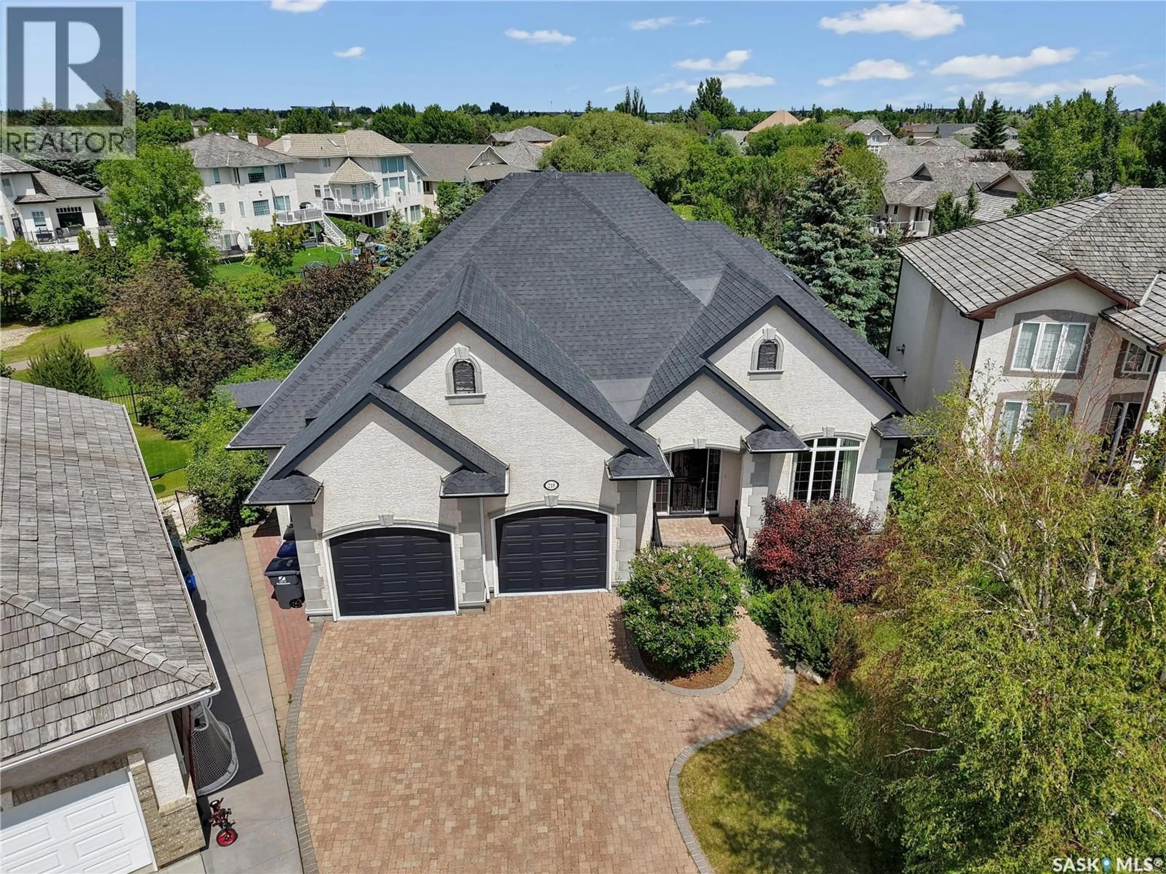 A pic from outside/outdoor area/front of a property/back of a property/a pic from drone, street for 218 HORLICK CRESCENT, Saskatoon Saskatchewan S7N4R5